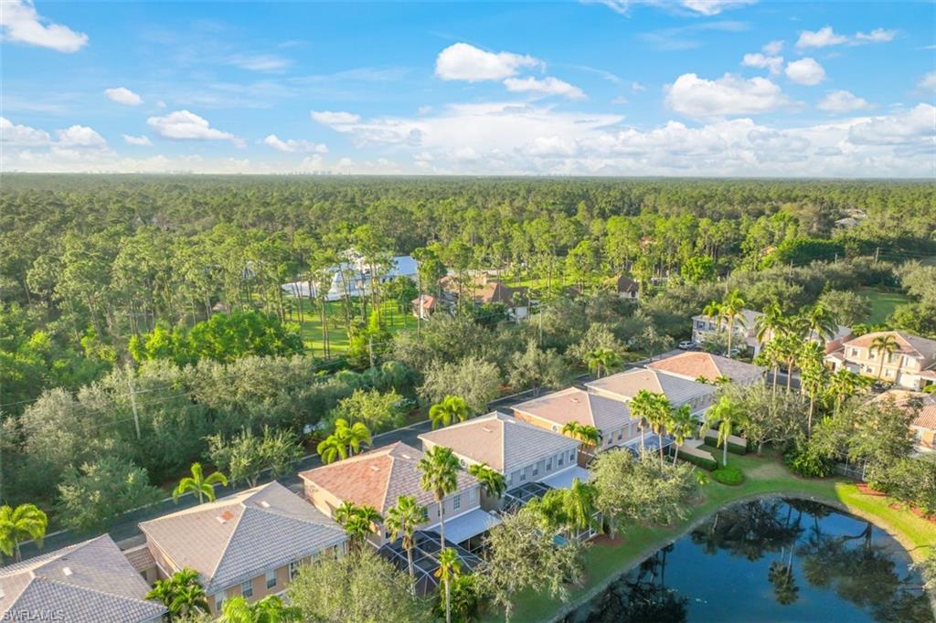 5721 Cove Circle, Unit 36 Naples, FL 34119 - Photo 28 of 32 an aerial view of residential houses with outdoor space
