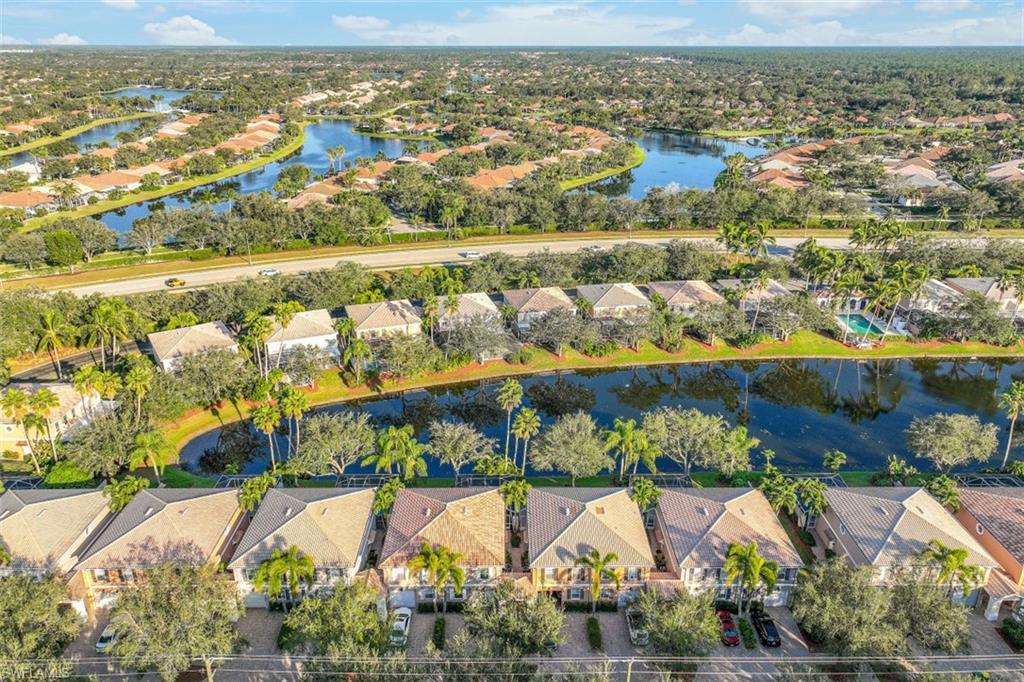 5721 Cove Circle, Unit 36 Naples, FL 34119 - Photo 29 of 32 a view of a city with an ocean