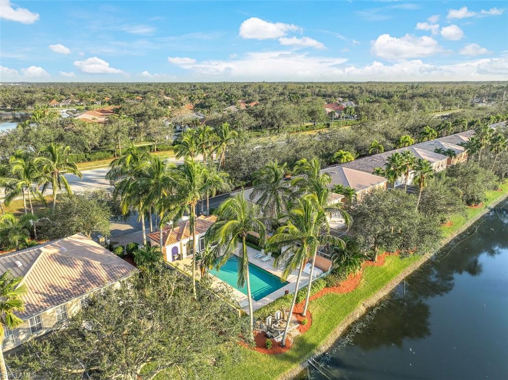 5721 Cove Circle, Unit 36 Naples, FL 34119 - Photo 30 of 32 a view of a lake from a balcony