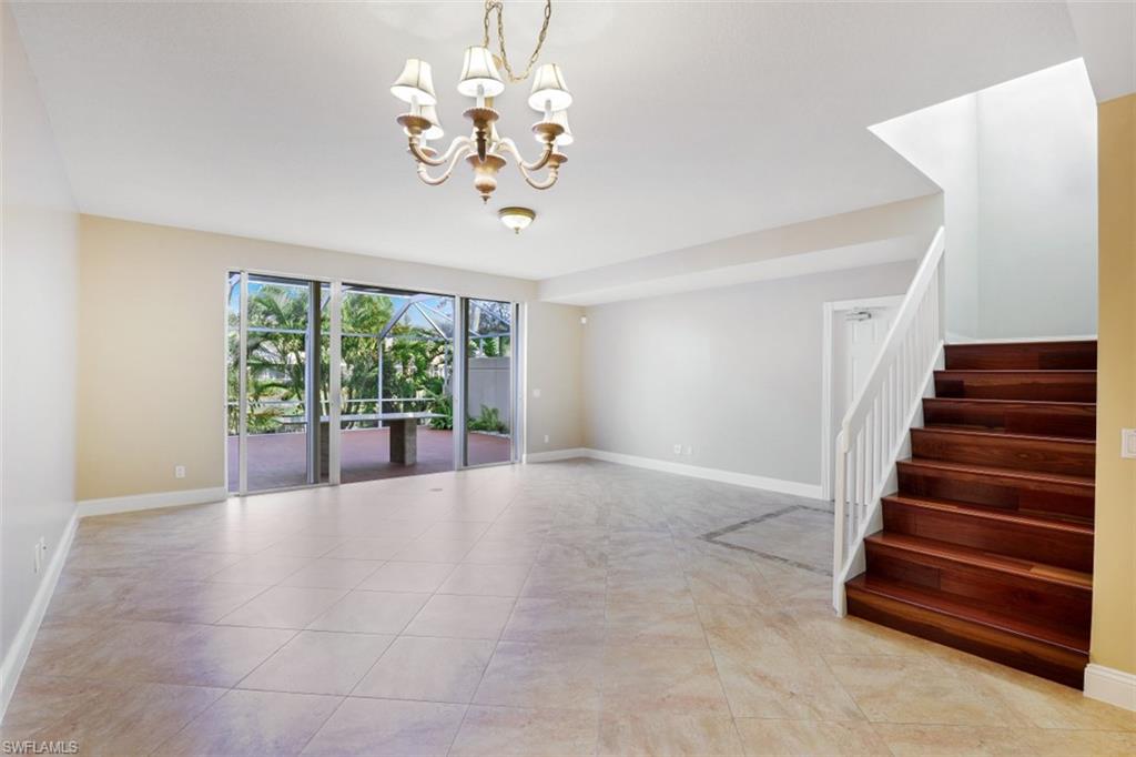 5721 Cove Circle, Unit 36 Naples, FL 34119 - Photo 3 of 32 a view of an empty room with a window