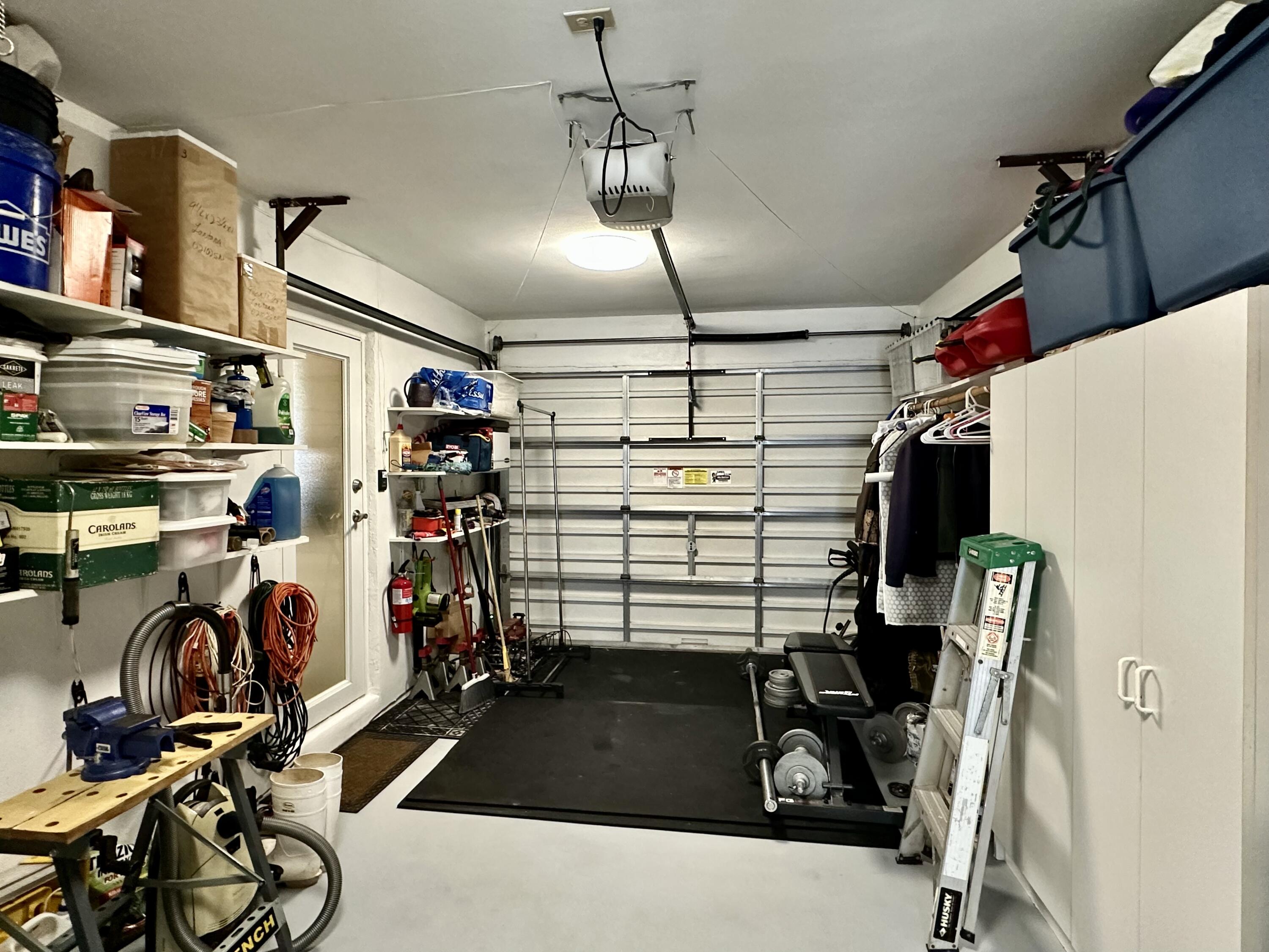 728 Ridge Road, Unit 35 Lantana, FL 33462 - Photo 19 of 35 Garage w Impact Door to Kitchen