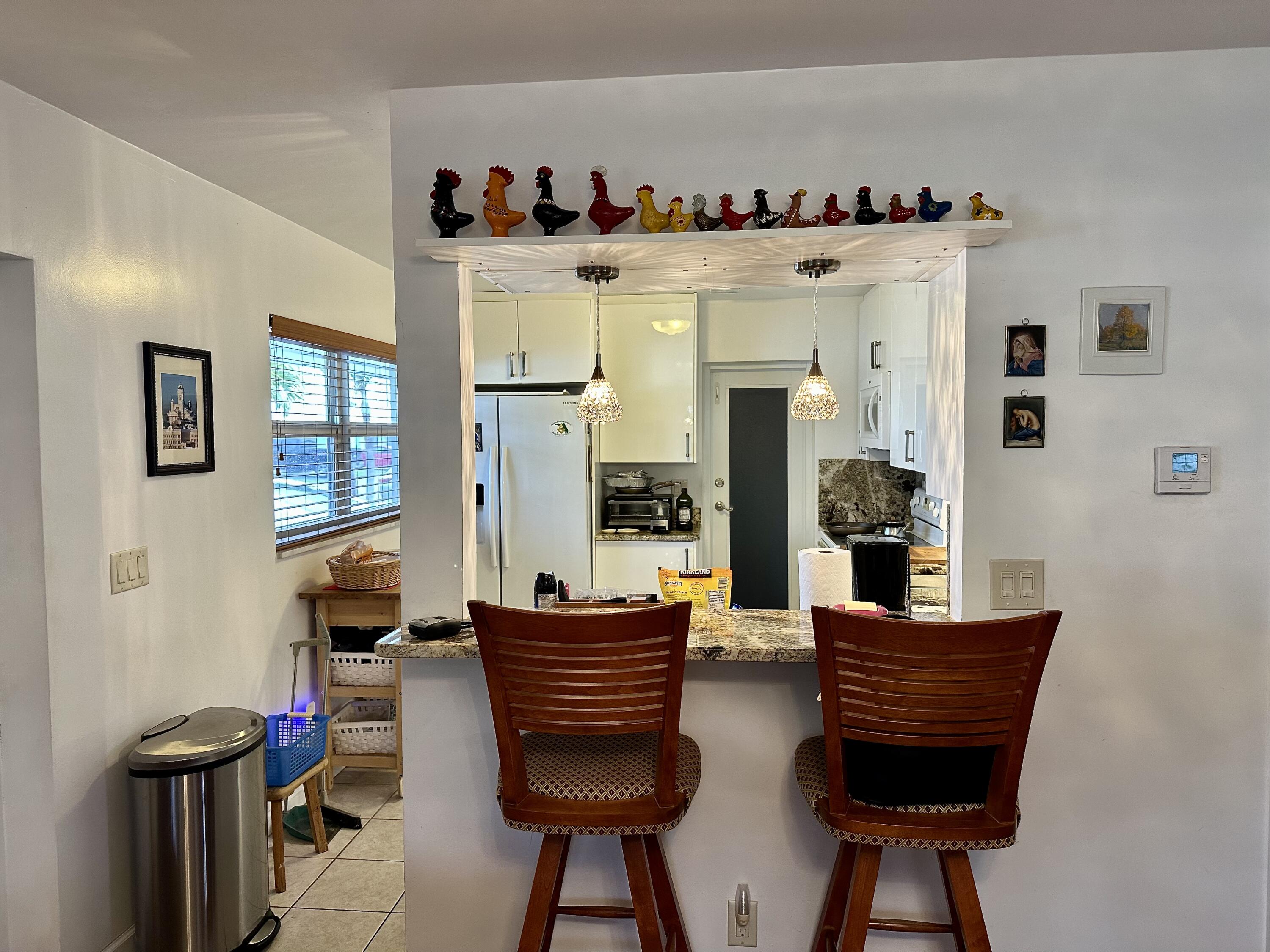 728 Ridge Road, Unit 35 Lantana, FL 33462 - Photo 3 of 35 Kitchen-Lv Rm Opening