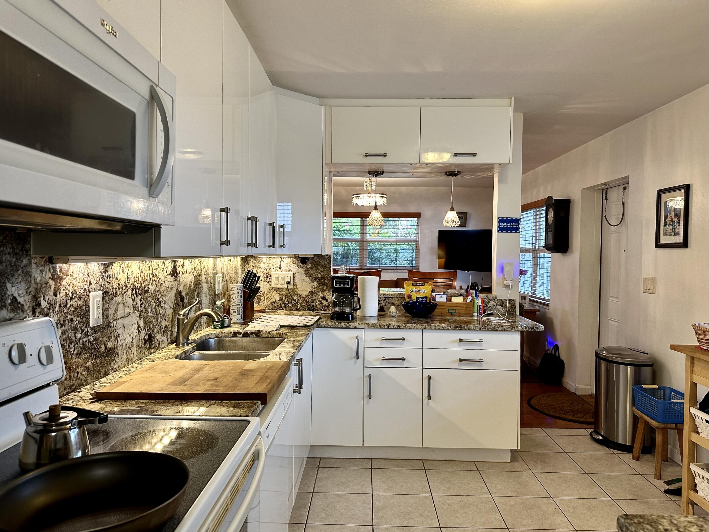 728 Ridge Road, Unit 35 Lantana, FL 33462 - Photo 32 of 35 Kitchen-from Garage