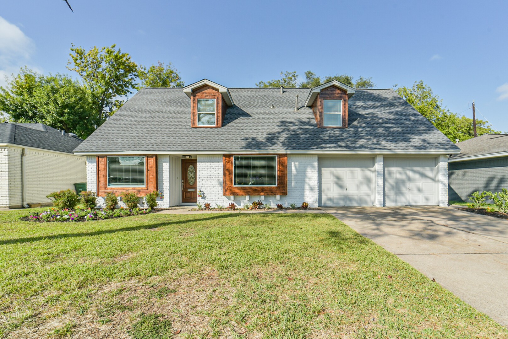 3319 Springrock Lane Houston, TX 77080 - Photo 1 of 41 a front view of a house with a garden and outdoor seating