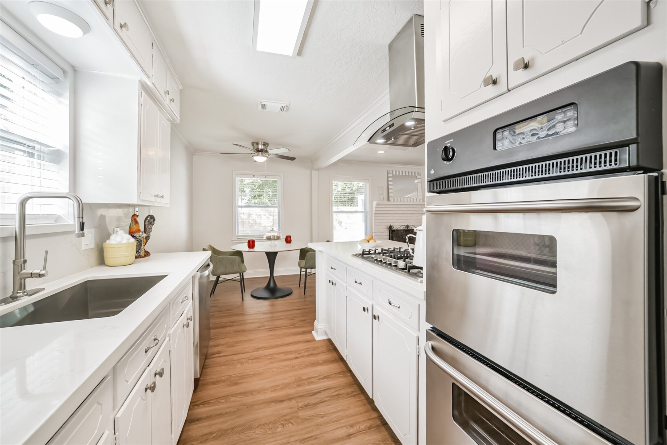 3319 Springrock Lane Houston, TX 77080 - Photo 11 of 41 a kitchen with granite countertop a sink stove and cabinets
