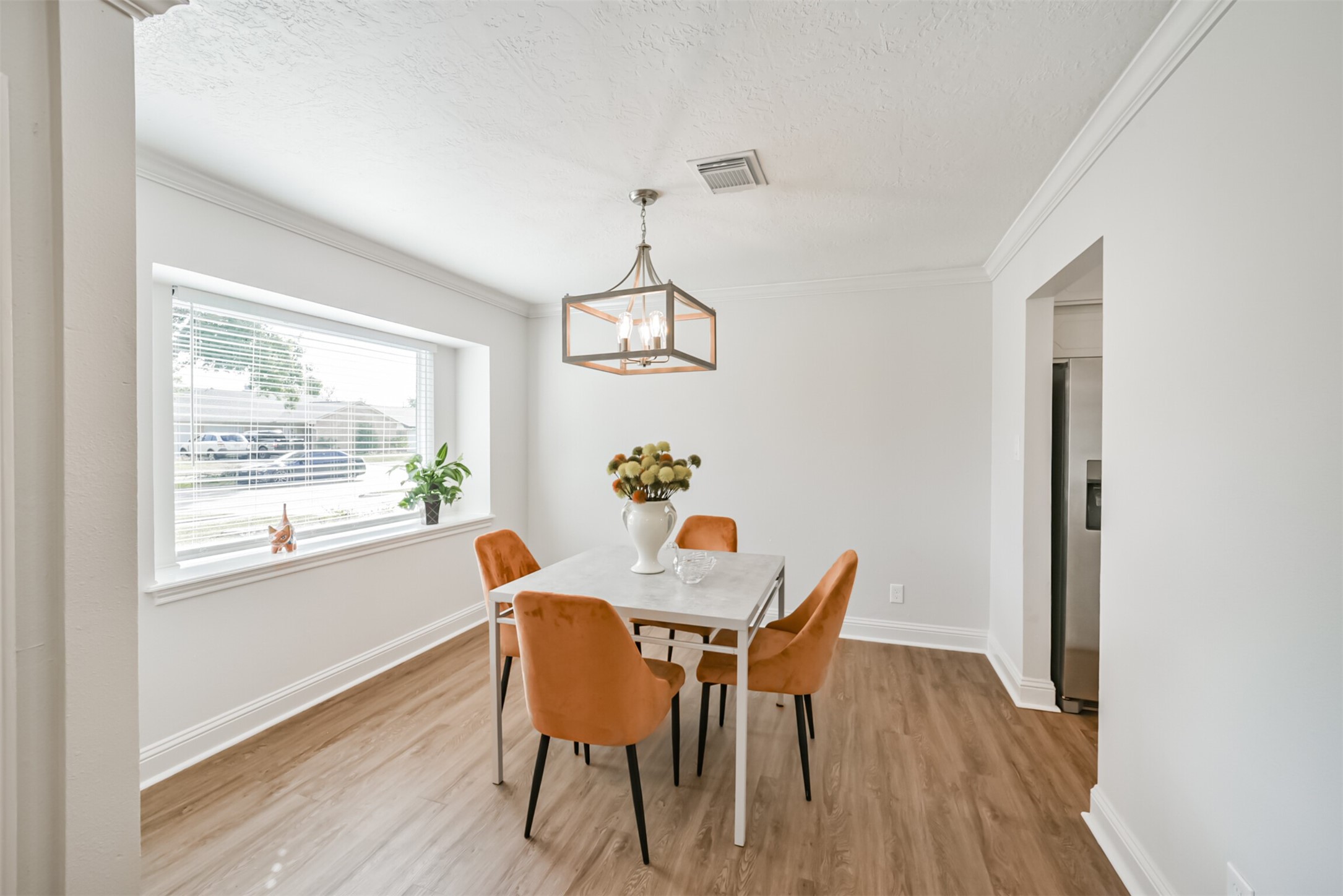 3319 Springrock Lane Houston, TX 77080 - Photo 16 of 41 a view of a dining room with furniture window and wooden floor