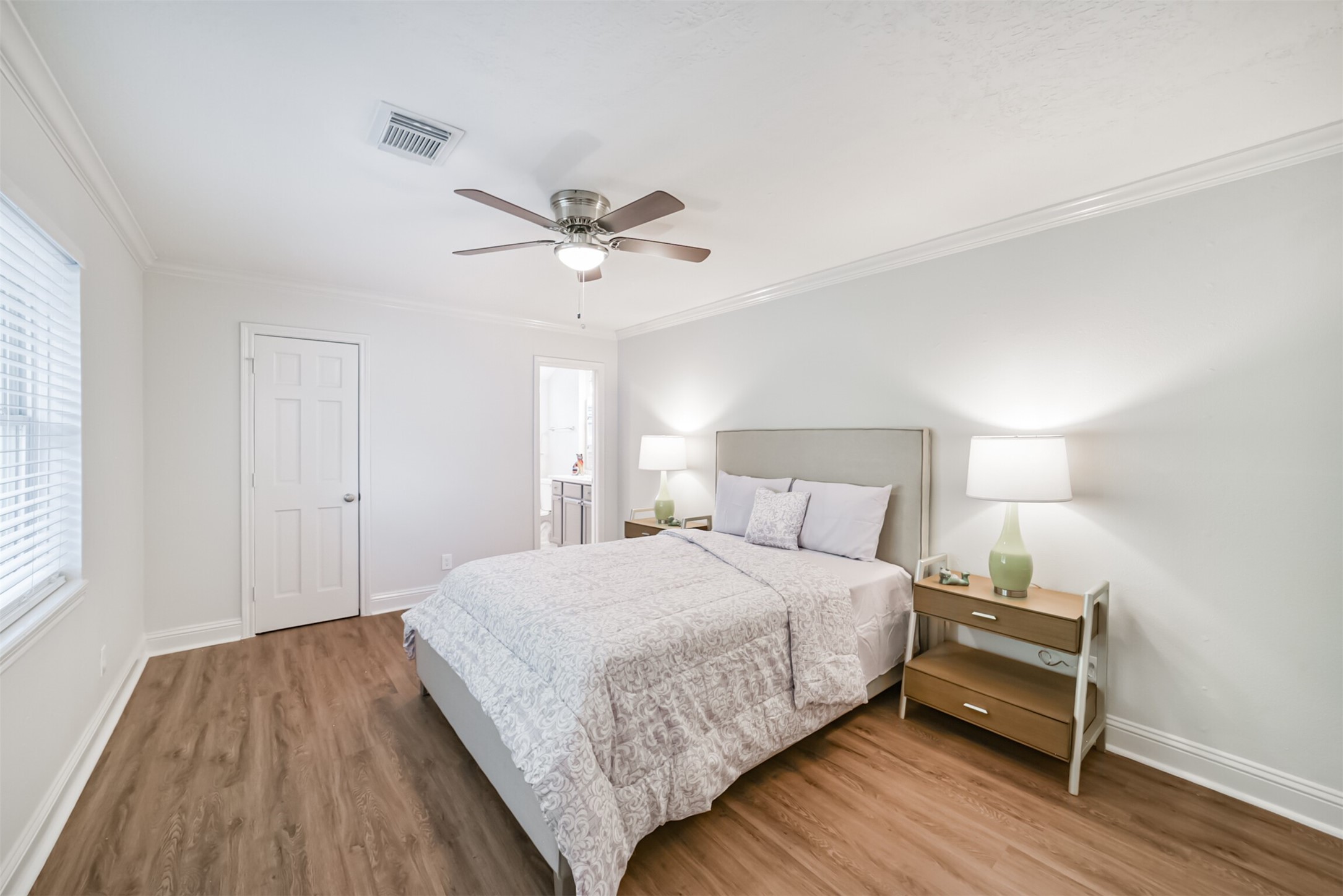 3319 Springrock Lane Houston, TX 77080 - Photo 20 of 41 a bedroom with a bed and wooden floor
