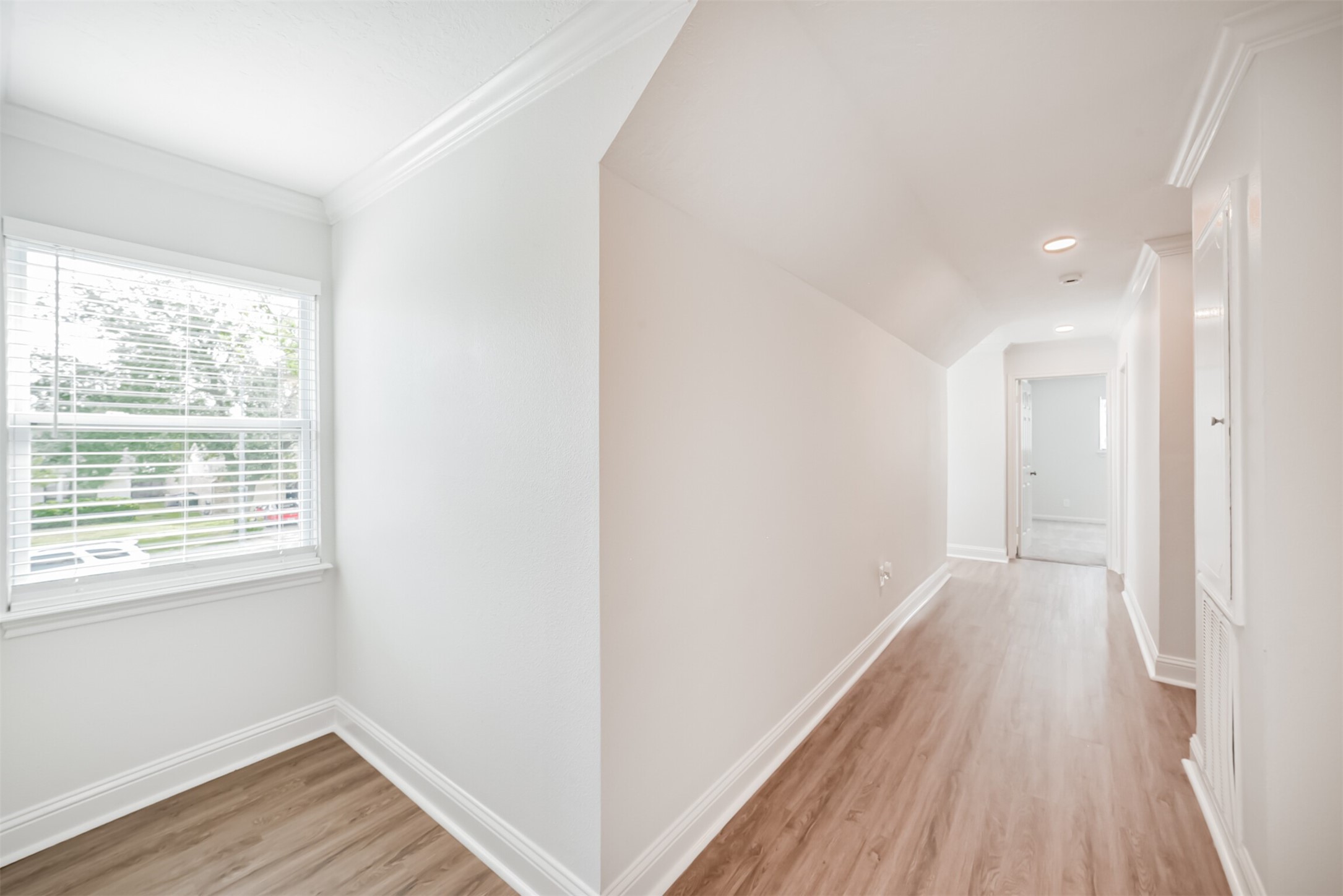 3319 Springrock Lane Houston, TX 77080 - Photo 26 of 41 a view of a hallway with wooden floor and a window