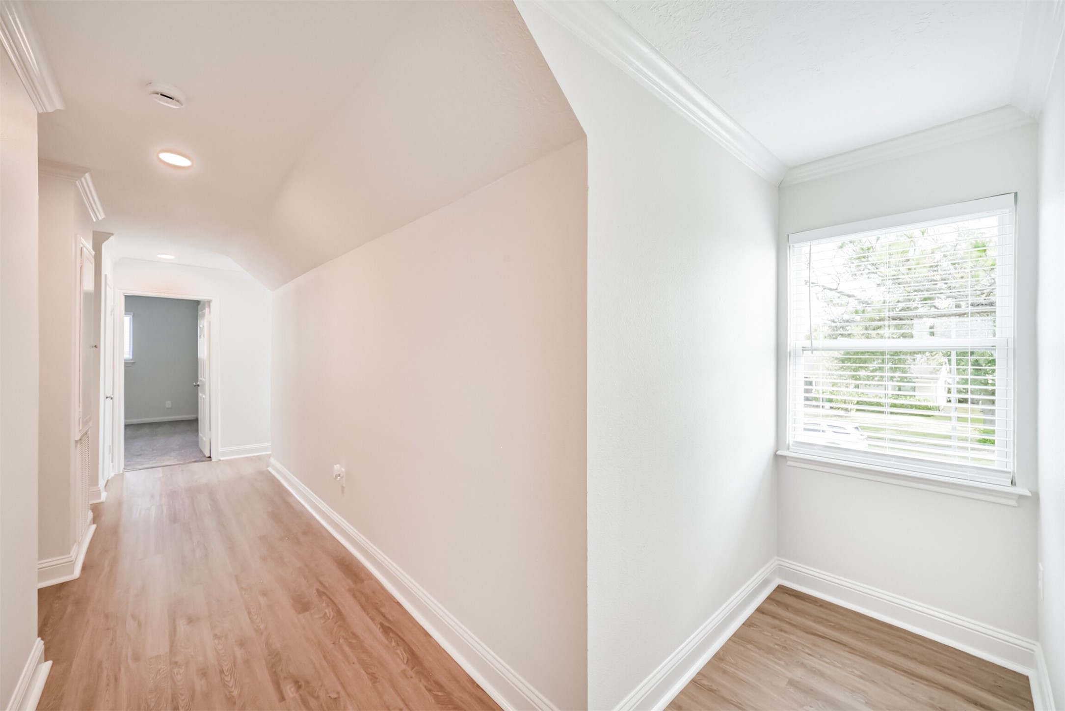 3319 Springrock Lane Houston, TX 77080 - Photo 27 of 41 a view of a hallway with wooden floor and a window