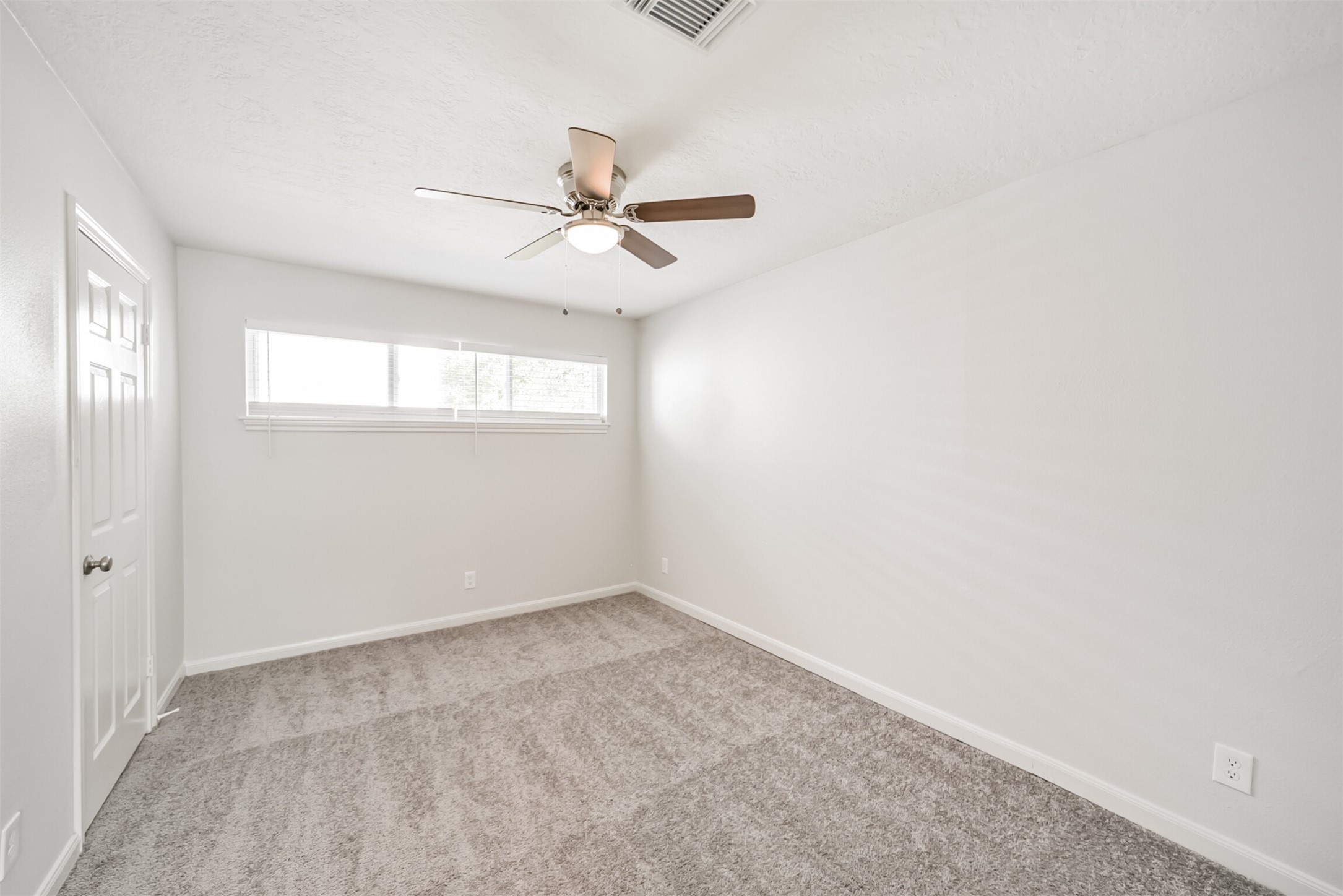 3319 Springrock Lane Houston, TX 77080 - Photo 29 of 41 wooden floor in an empty room with a window