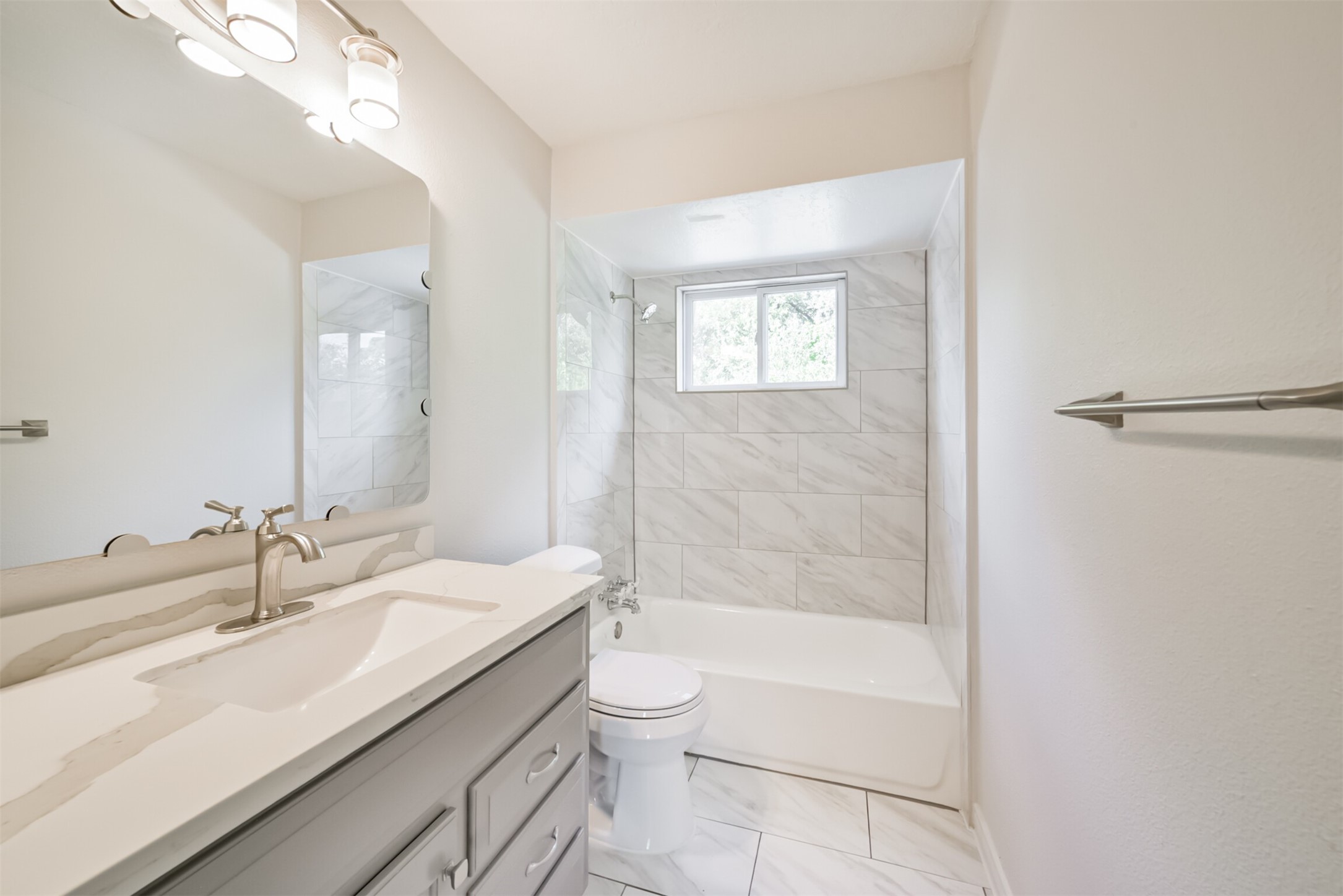 3319 Springrock Lane Houston, TX 77080 - Photo 31 of 41 a bathroom with a double vanity sink toilet and shower
