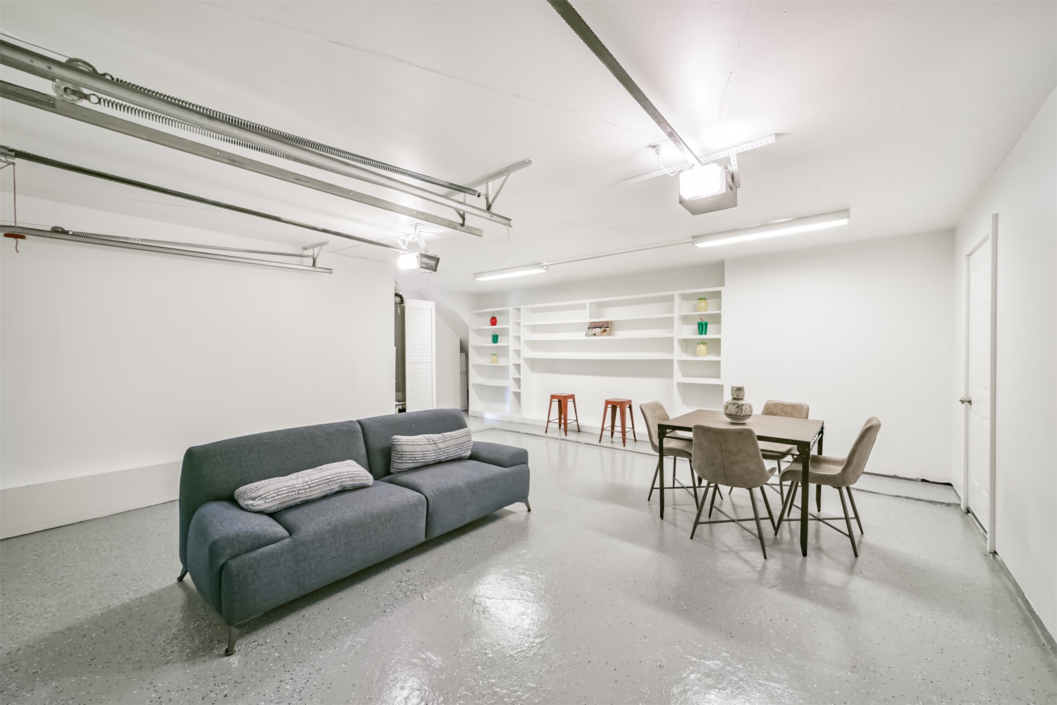 3319 Springrock Lane Houston, TX 77080 - Photo 36 of 41 a living room with furniture and a dining table with kitchen view