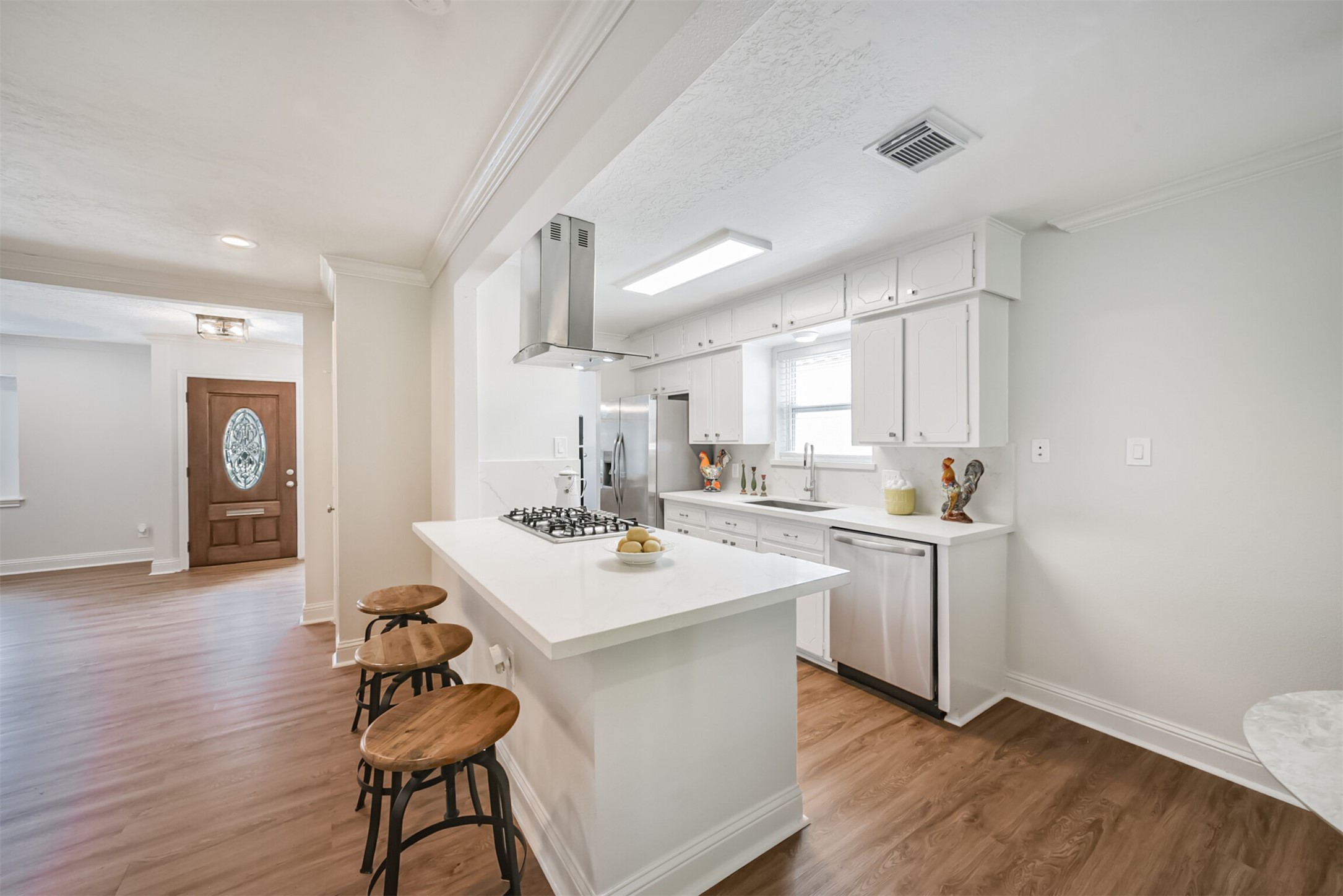 3319 Springrock Lane Houston, TX 77080 - Photo 7 of 41 a kitchen with a sink cabinets and wooden floor