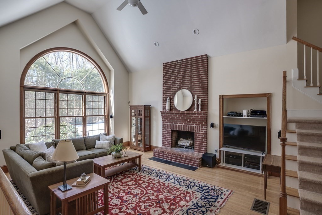 26 Coventry Road Atkinson, NH 03811 - Photo 24 of 42 a living room with furniture a window and a fireplace