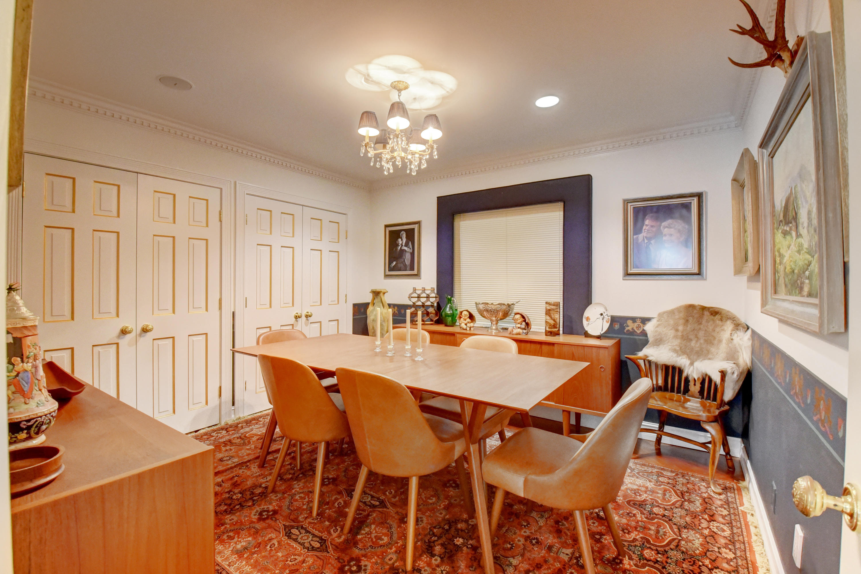 6318 Woodbury Road Boca Raton, FL 33433 - Photo 17 of 52 a view of a dining room with furniture and chandelier