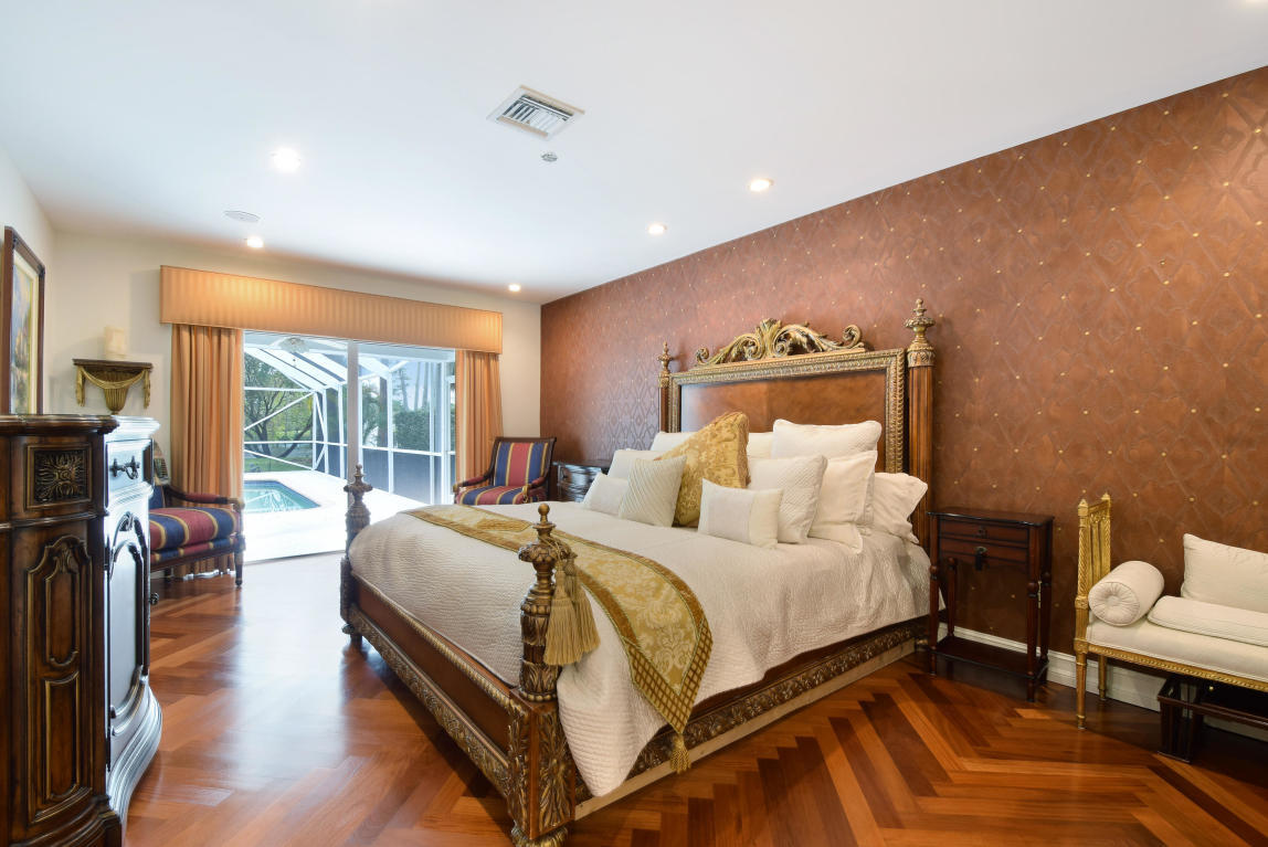 6318 Woodbury Road Boca Raton, FL 33433 - Photo 20 of 52 a bedroom with bed and a large window