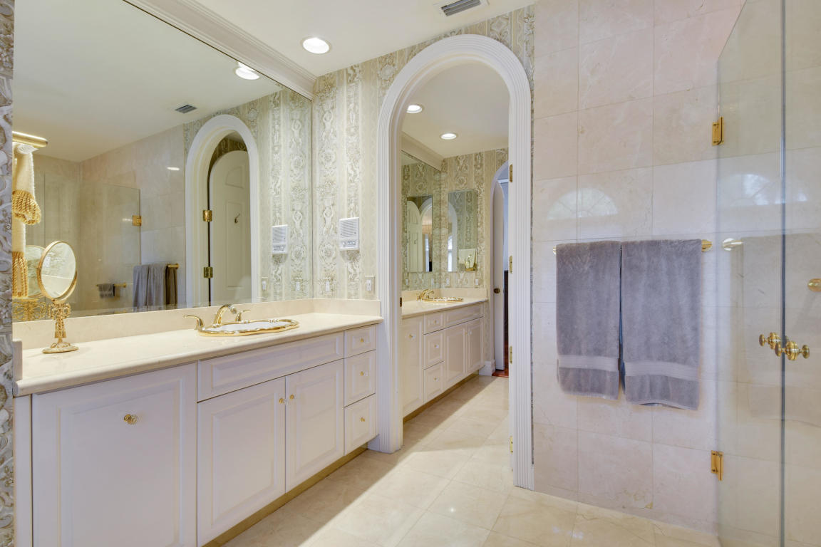 6318 Woodbury Road Boca Raton, FL 33433 - Photo 22 of 52 a spacious bathroom with a granite countertop sink mirror and shower