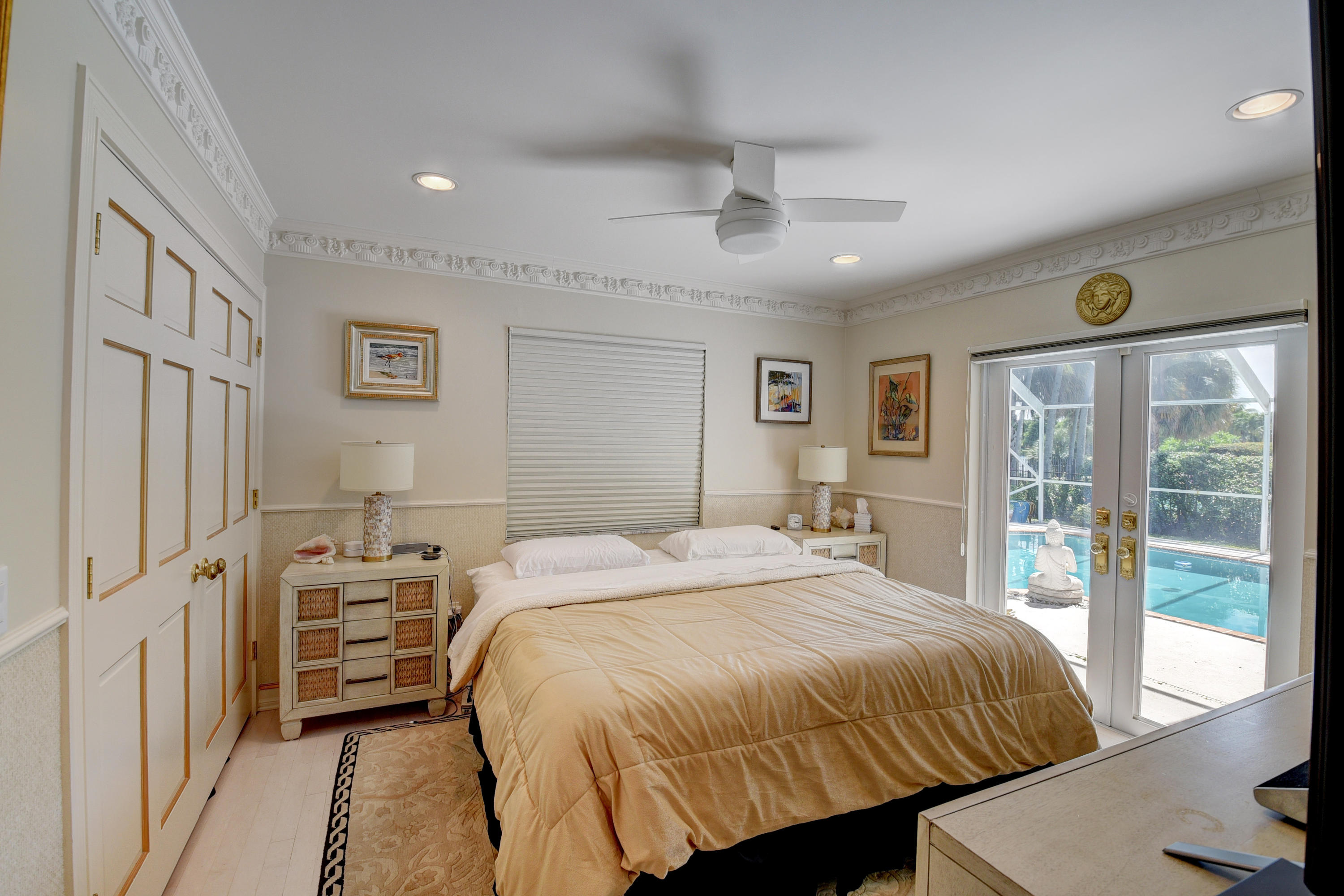 6318 Woodbury Road Boca Raton, FL 33433 - Photo 27 of 52 a bedroom with a large bed and a window