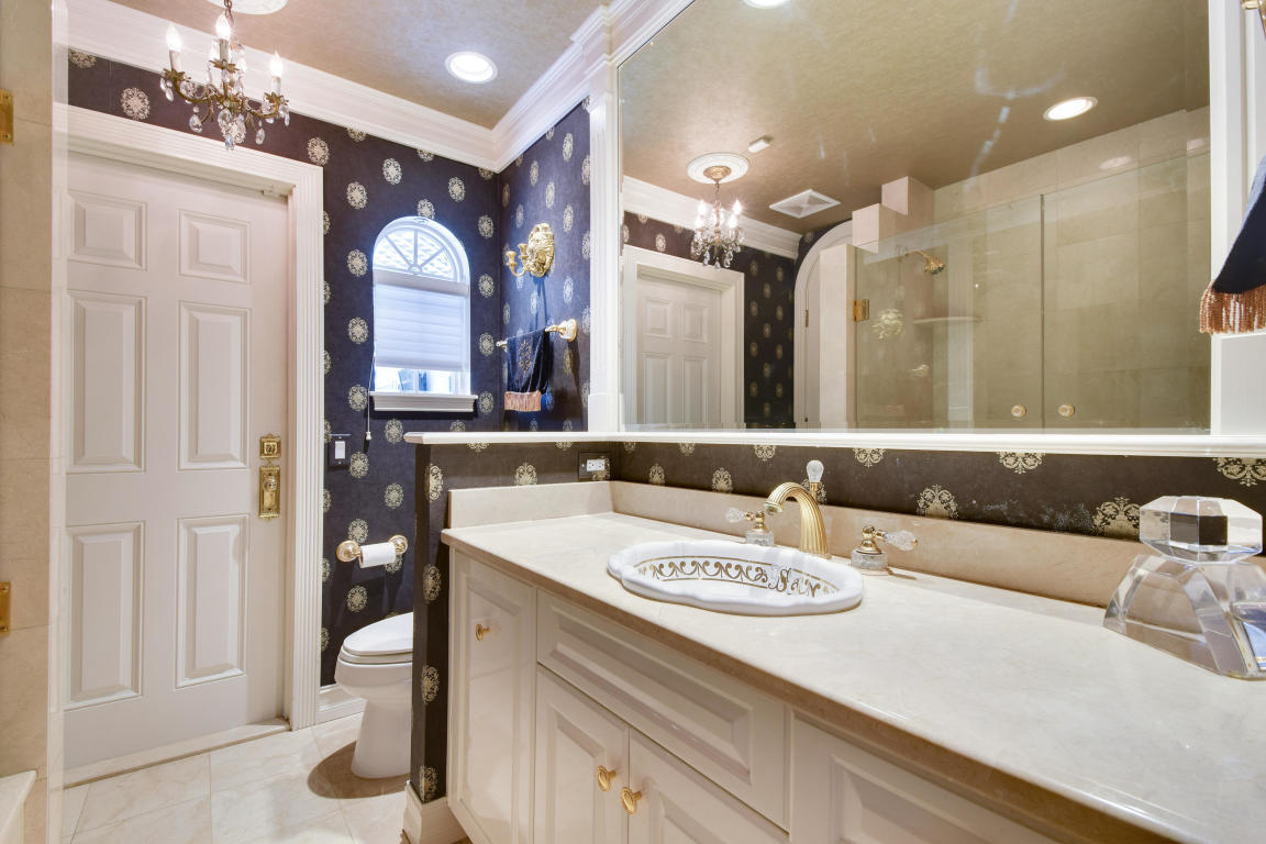 6318 Woodbury Road Boca Raton, FL 33433 - Photo 28 of 52 a bathroom with a sink double vanity and a mirror