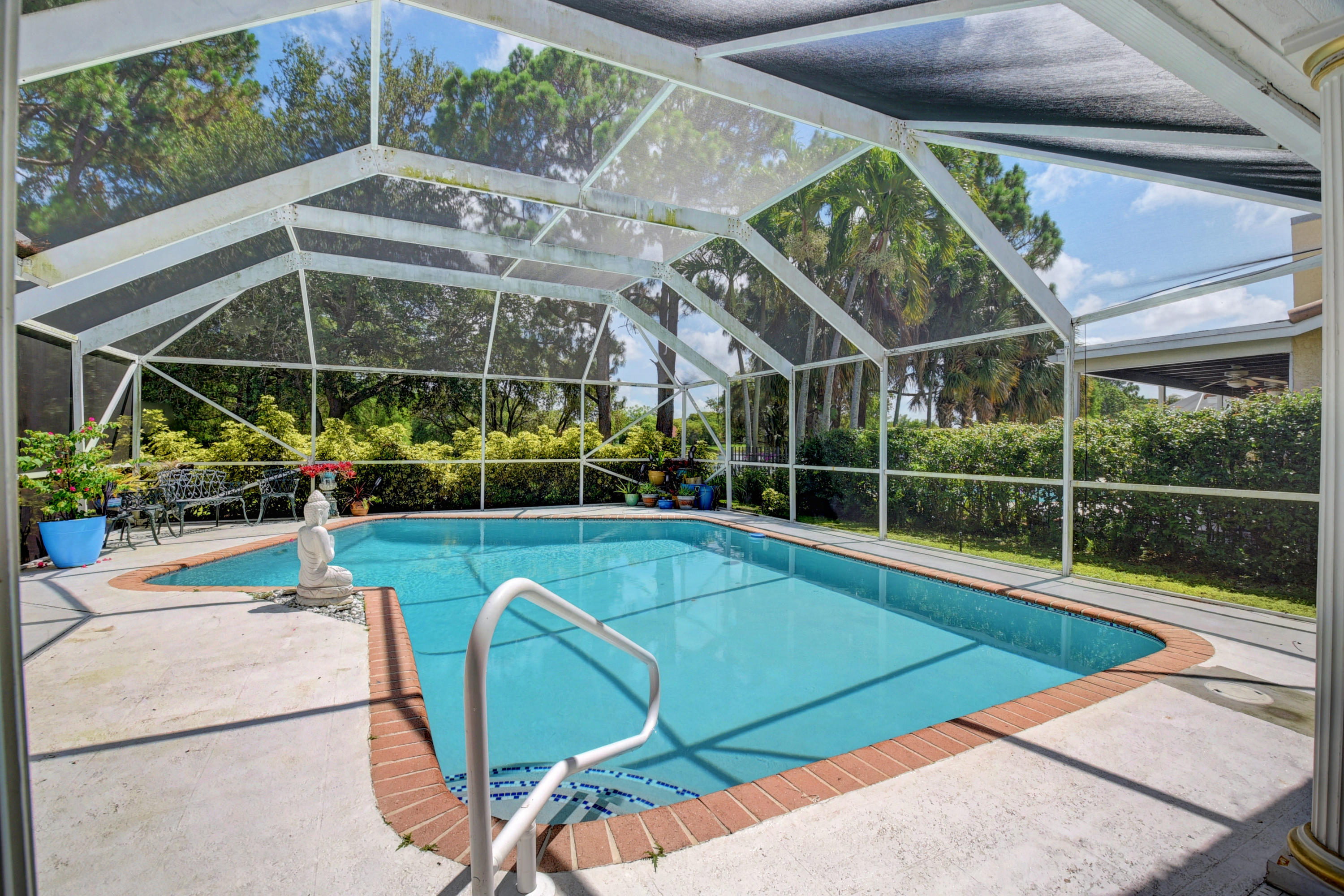 6318 Woodbury Road Boca Raton, FL 33433 - Photo 32 of 52 a view of a backyard with sitting area