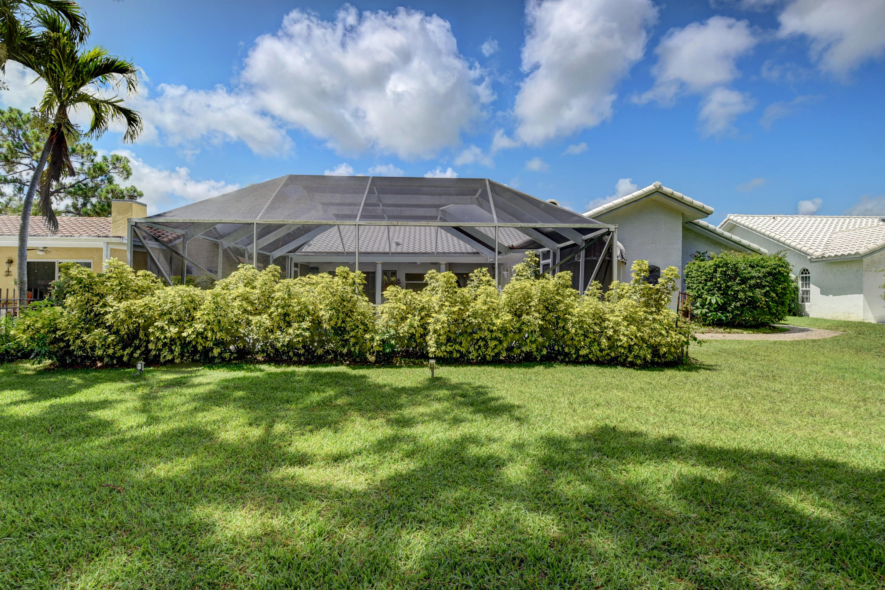 6318 Woodbury Road Boca Raton, FL 33433 - Photo 36 of 52 a view of a house with a garden