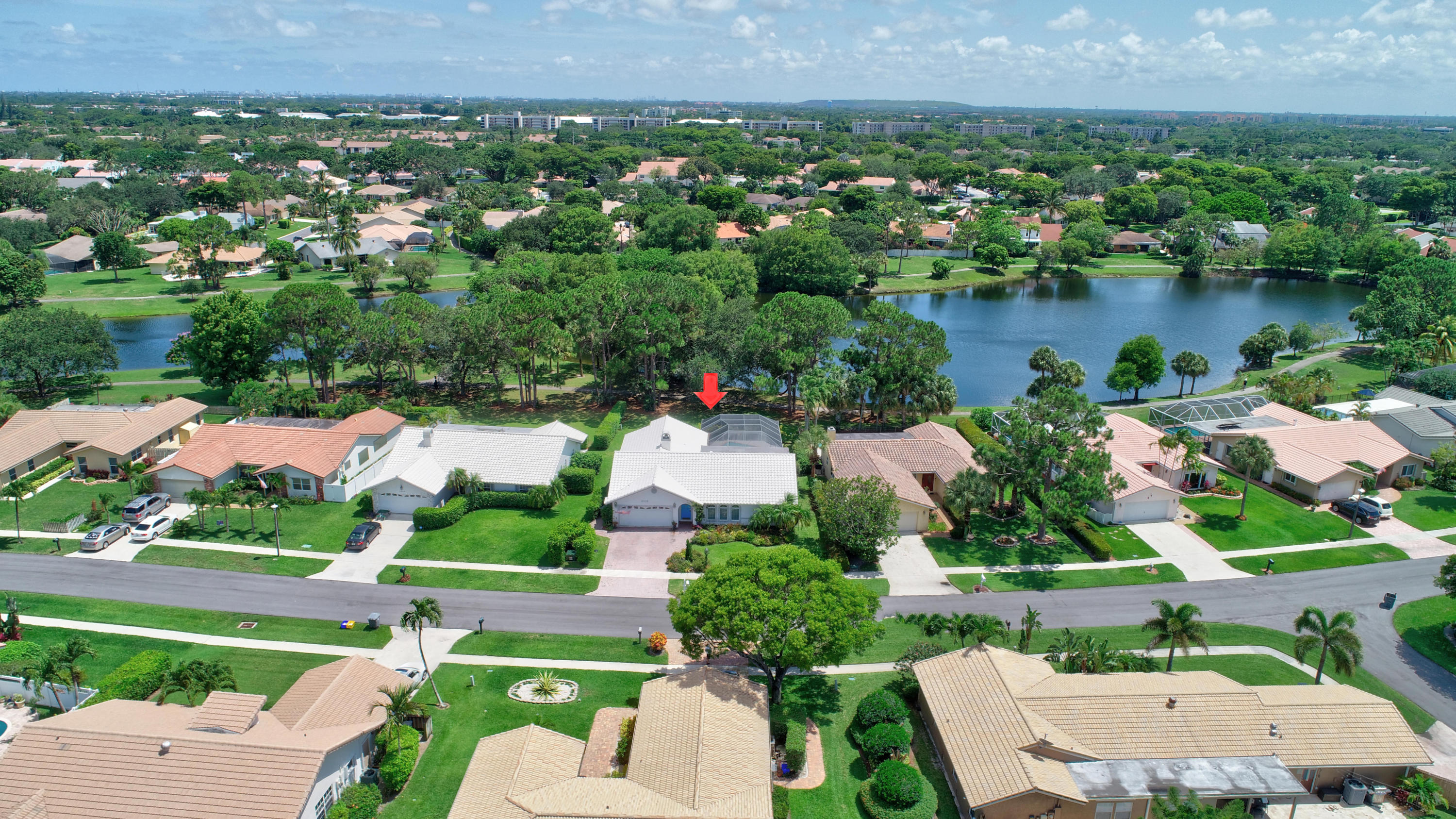 6318 Woodbury Road Boca Raton, FL 33433 - Photo 43 of 52 an aerial view of a house with a yard and lake view
