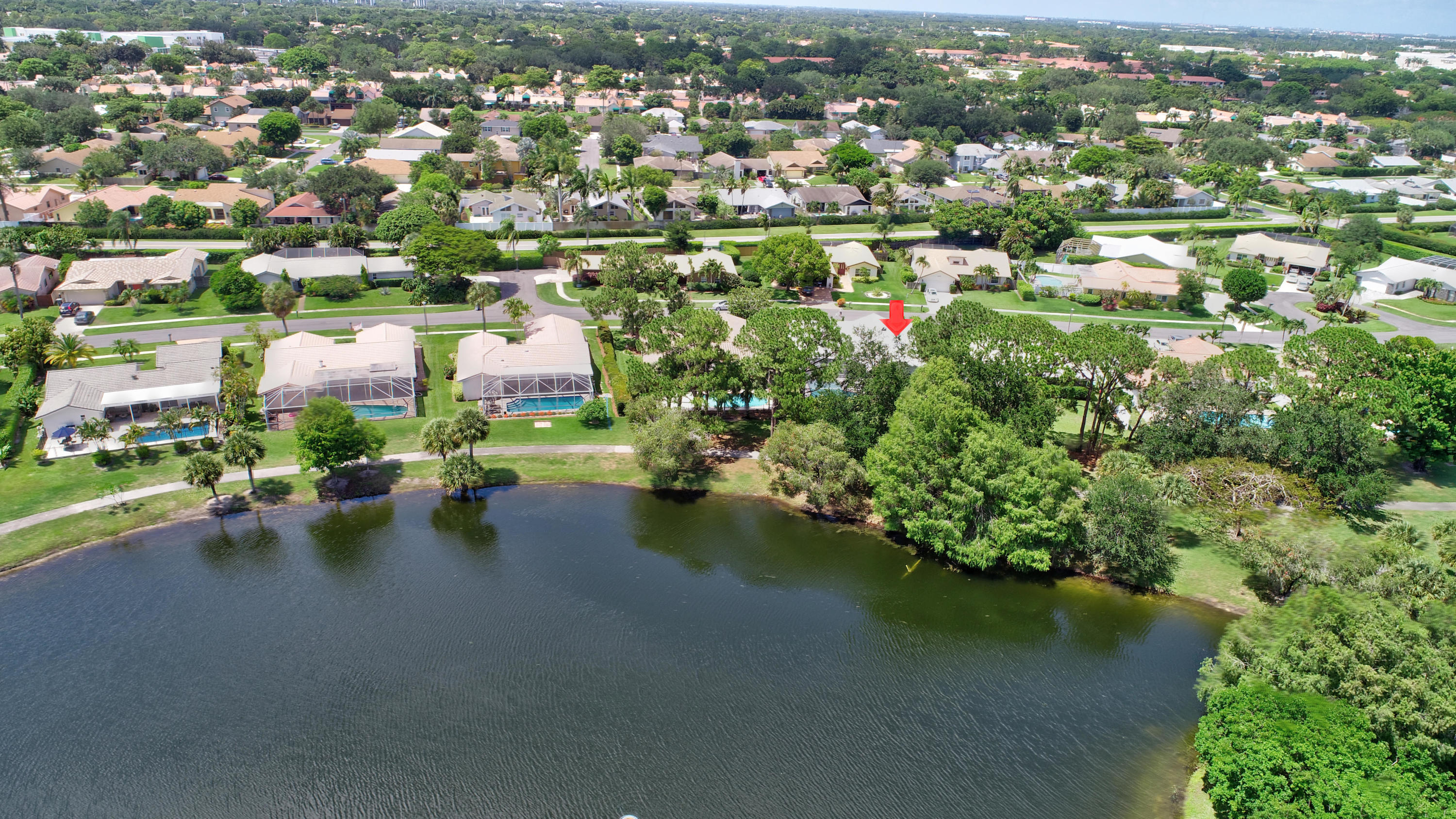 6318 Woodbury Road Boca Raton, FL 33433 - Photo 45 of 52 an aerial view of a houses with a lake view
