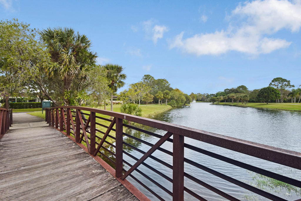 6318 Woodbury Road Boca Raton, FL 33433 - Photo 49 of 52 a view of balcony with wooden floor and lake view