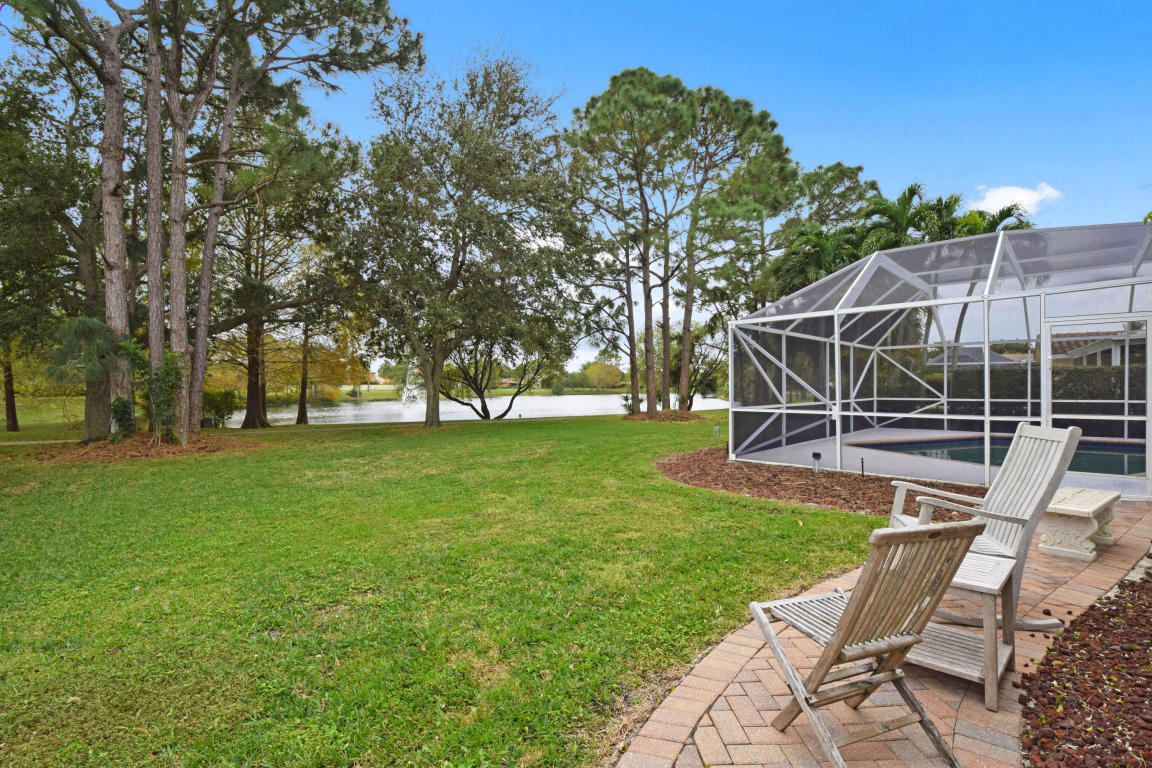 6318 Woodbury Road Boca Raton, FL 33433 - Photo 52 of 52 a view of a house with backyard and sitting area