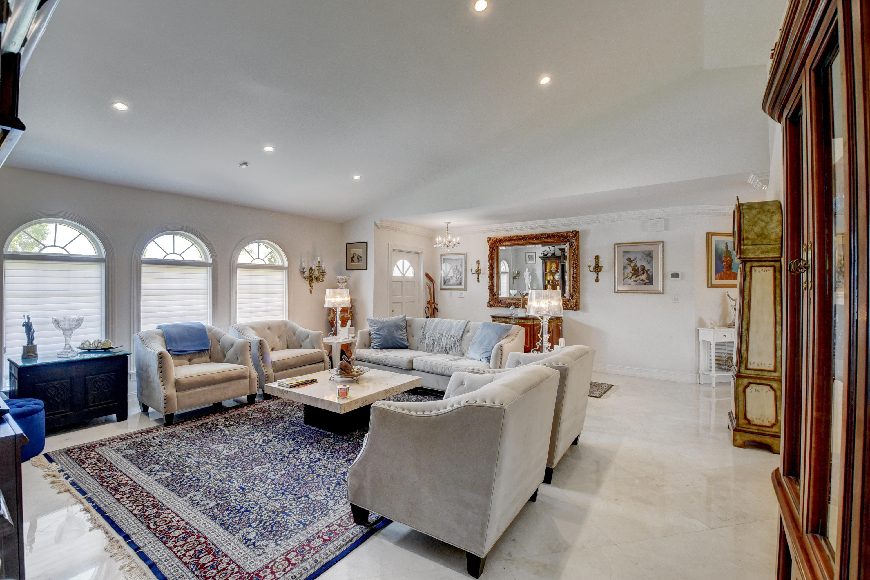 6318 Woodbury Road Boca Raton, FL 33433 - Photo 7 of 52 a living room with furniture and a rug