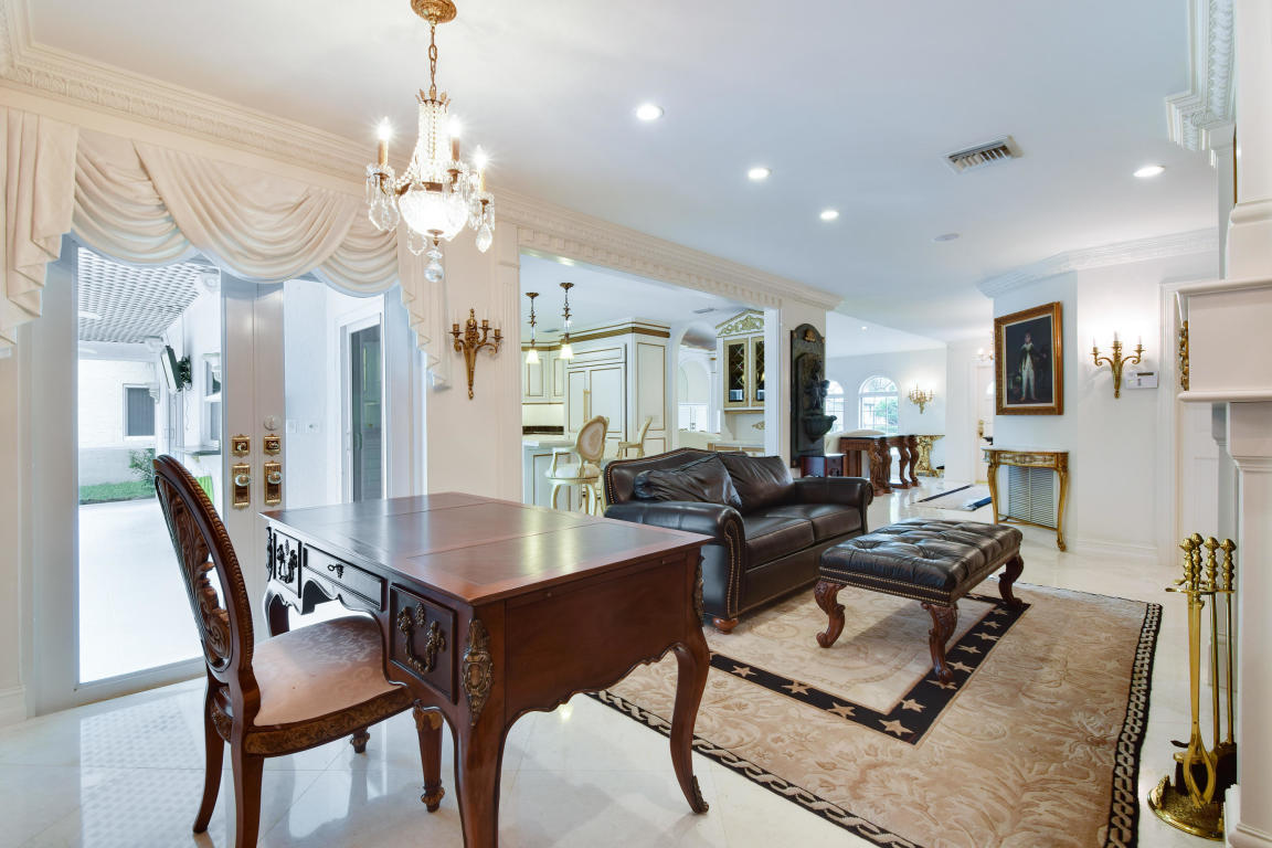 6318 Woodbury Road Boca Raton, FL 33433 - Photo 8 of 52 a living room with furniture kitchen view and a chandelier