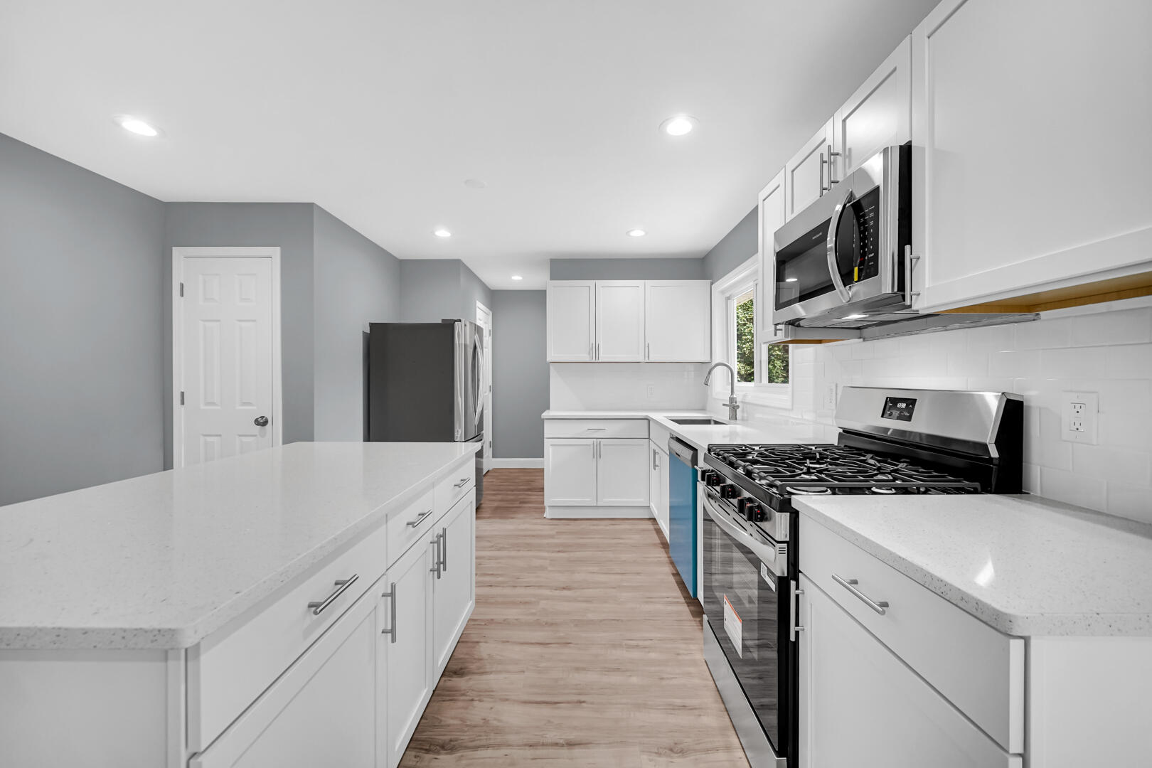 8013 Monaldi Drive Munster, IN 46321 - Photo 12 of 24 a large kitchen with stainless steel appliances granite countertop a stove a sink and a refrigerator