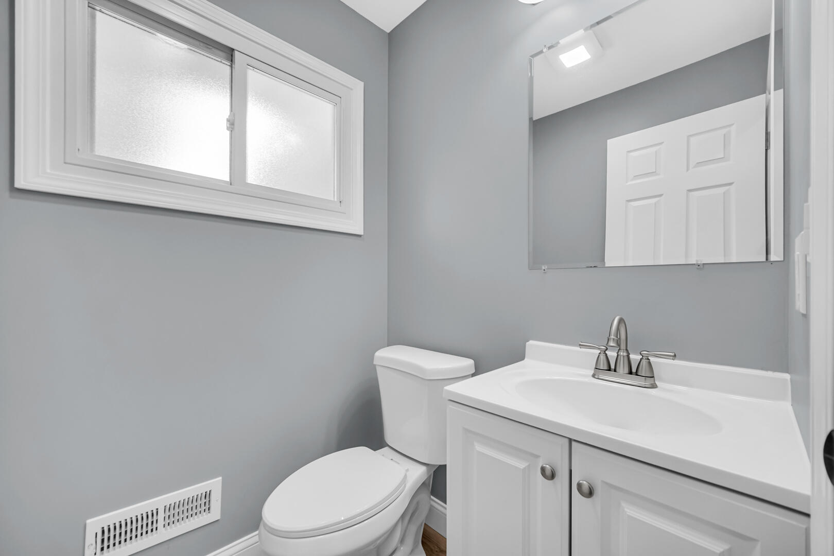 8013 Monaldi Drive Munster, IN 46321 - Photo 14 of 24 a bathroom with a sink a toilet and a mirror