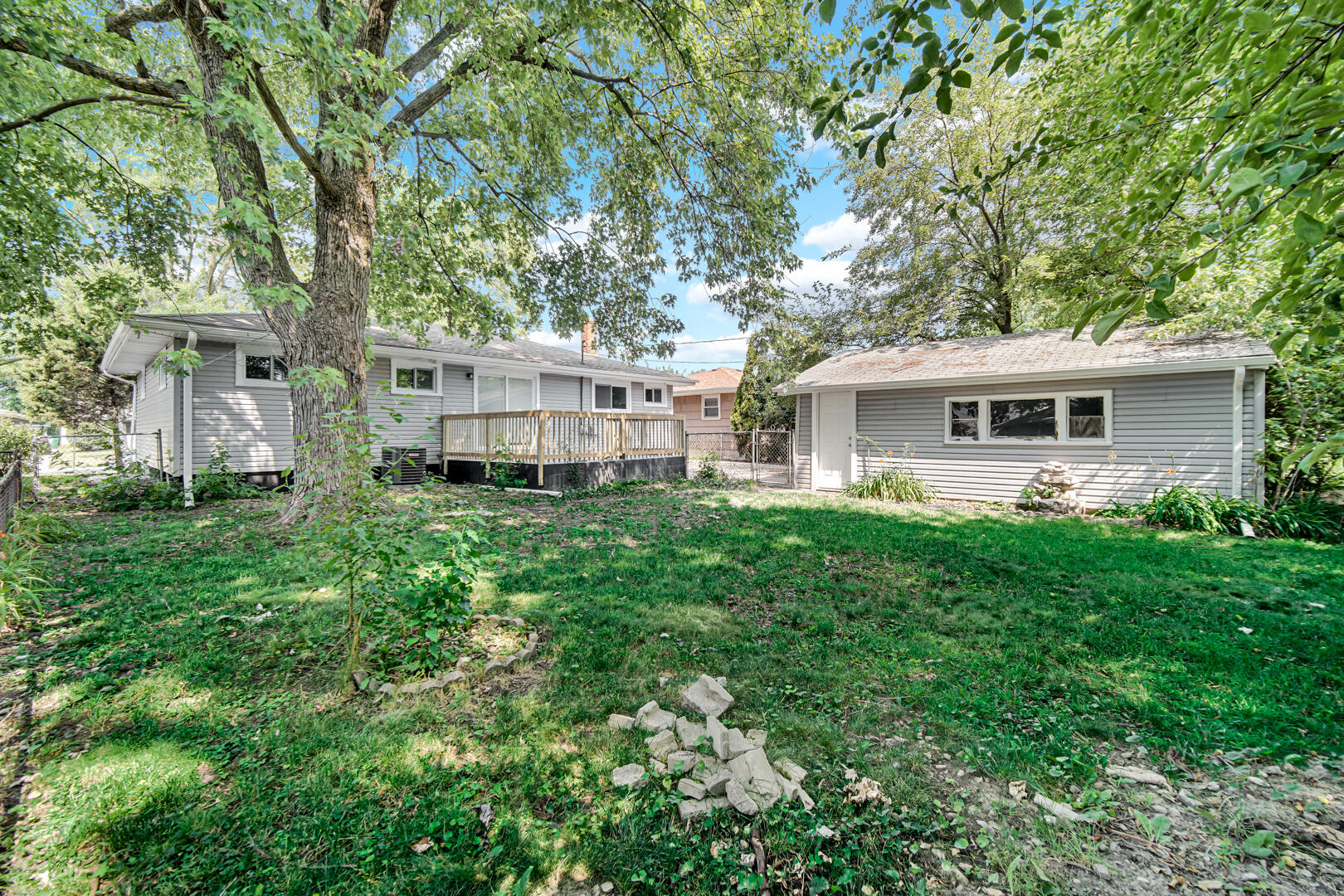8013 Monaldi Drive Munster, IN 46321 - Photo 24 of 24 a view of a house with a backyard and a patio