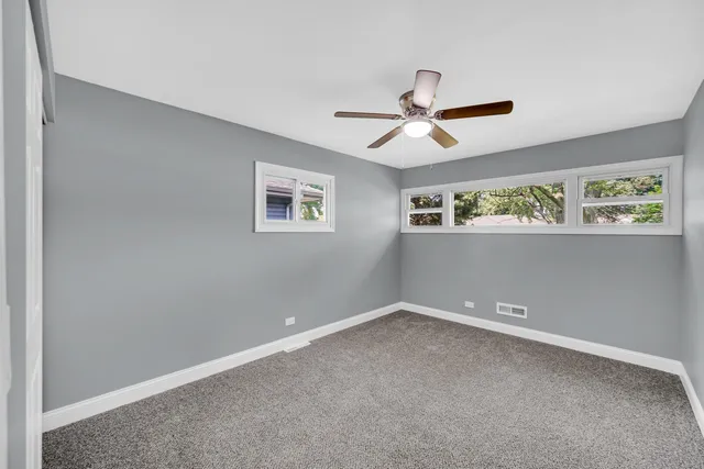 a view of room with ceiling fan