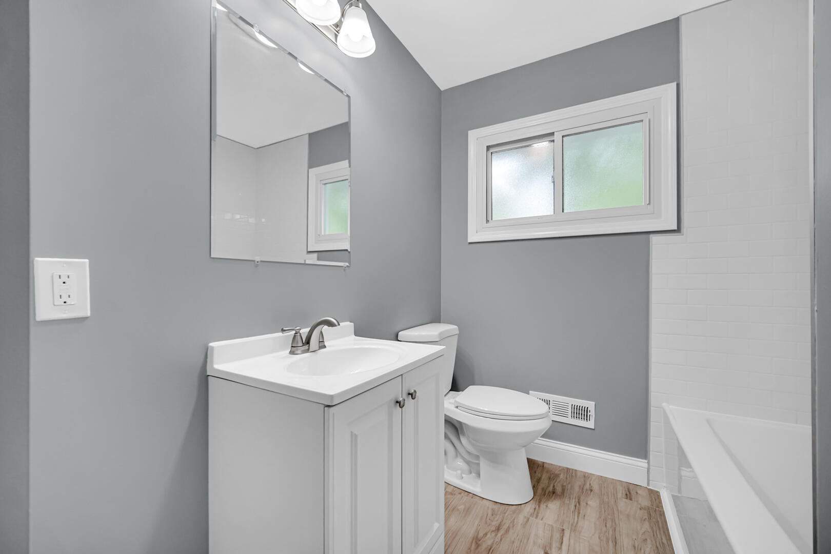 8013 Monaldi Drive Munster, IN 46321 - Photo 7 of 24 a bathroom with a sink toilet and a mirror