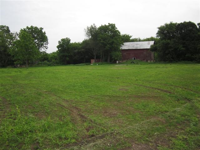 11625 Moate Road Durand, IL 61024 - Photo 3 of 4 a view of a backyard with a garden