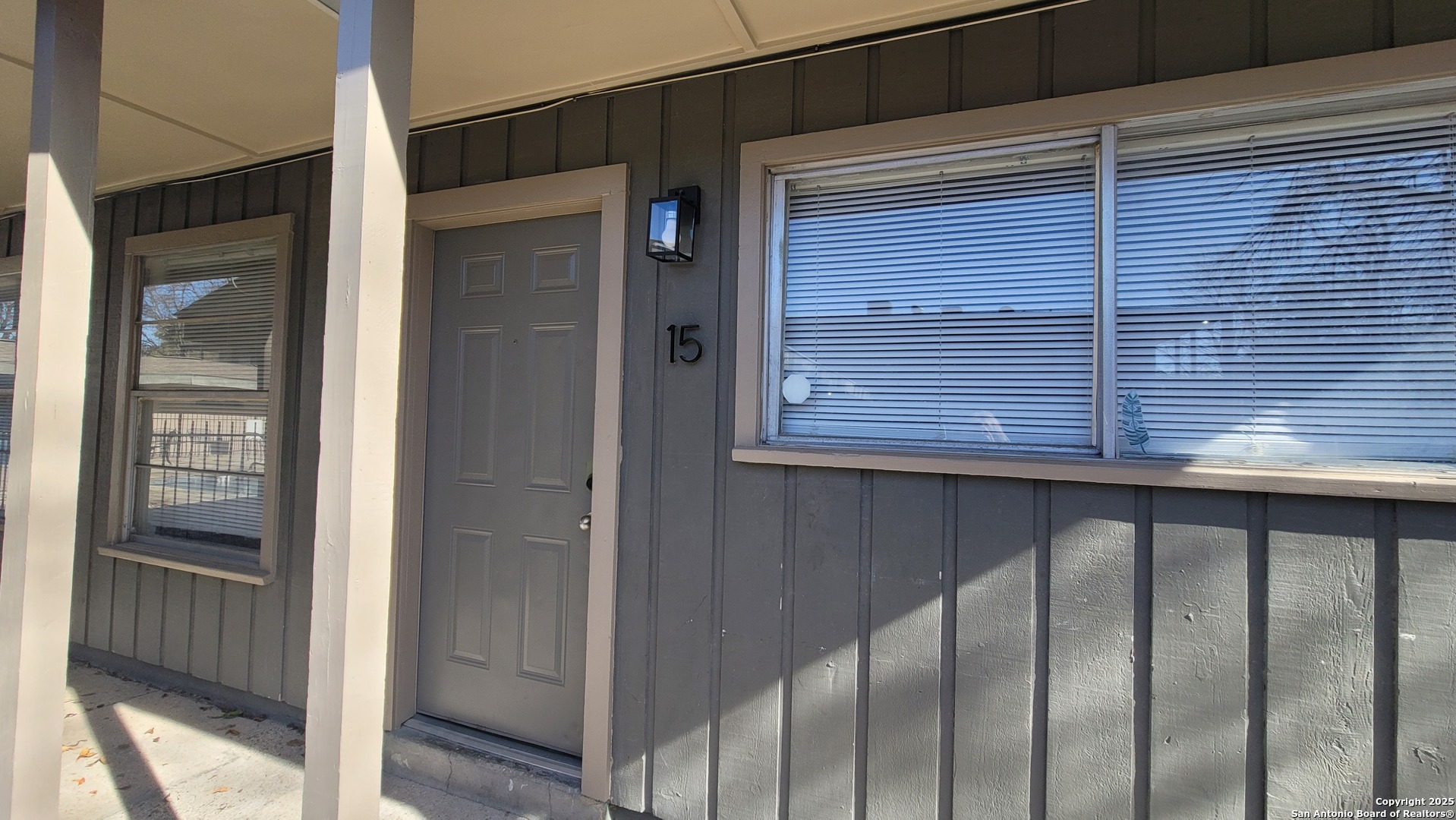 a view of a balcony wooden door