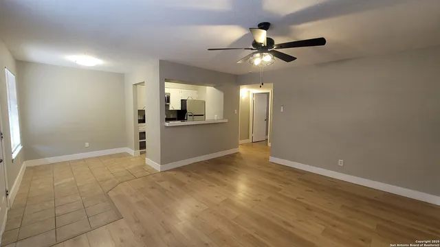 a view of a kitchen with a sink and cabinet area
