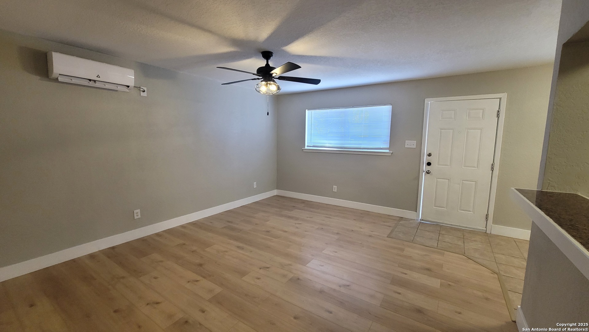 516 Gentleman Road, Unit 15 San Antonio, TX 78201 - Photo 5 of 12 a view of empty room with wooden floor