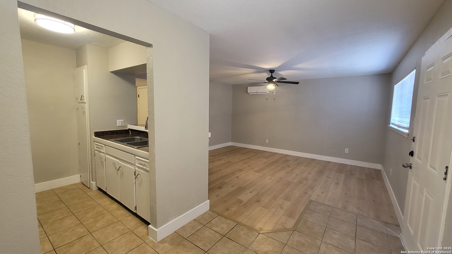 516 Gentleman Road, Unit 15 San Antonio, TX 78201 - Photo 6 of 12 a view of a kitchen with a sink and a stove top oven