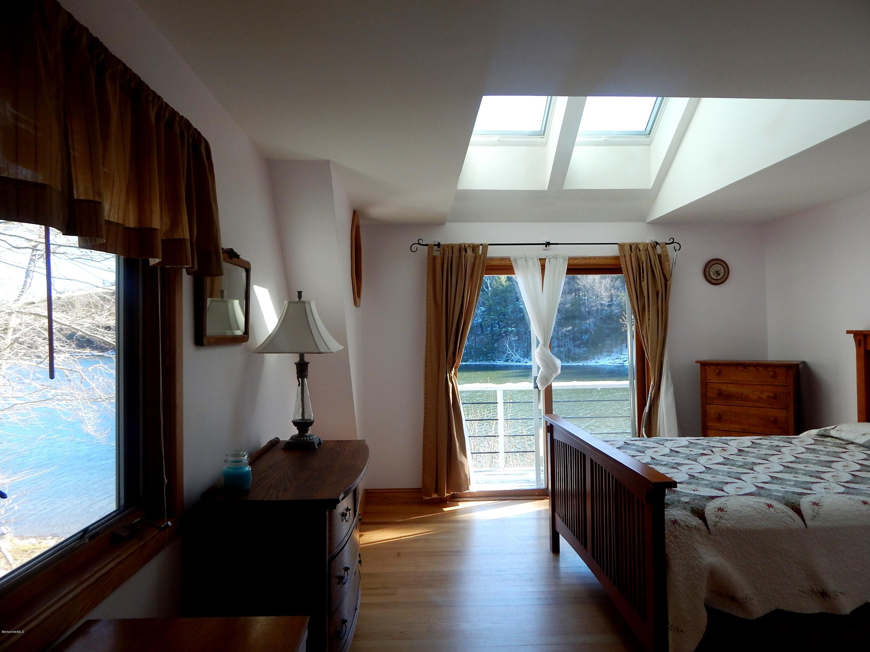 25 Point Road Monterey, MA 01245 - Photo 11 of 19 a bedroom with a bed and wooden floor