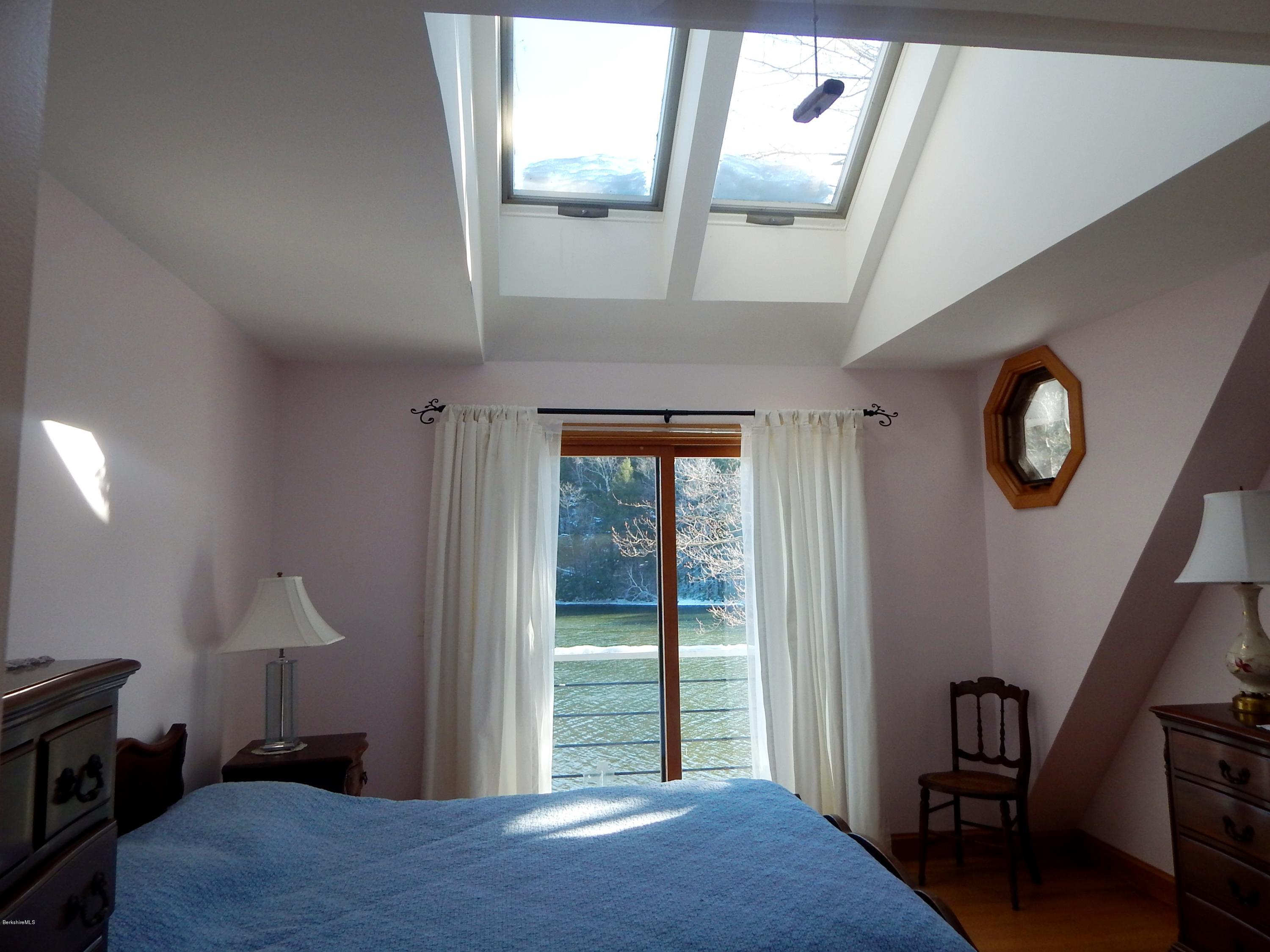 25 Point Road Monterey, MA 01245 - Photo 13 of 19 a bedroom with a bed and a window
