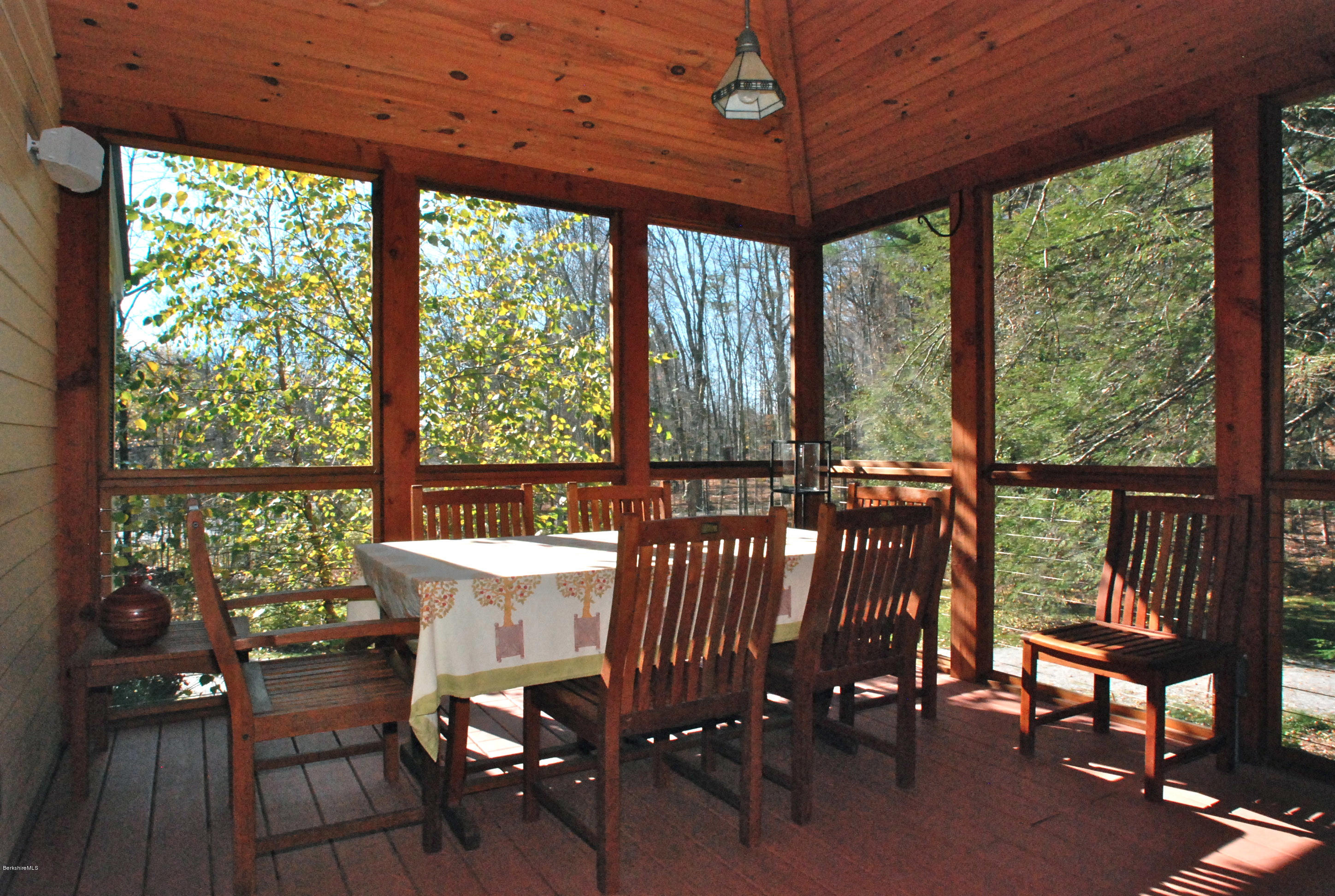 101 Tyringham Road Monterey, MA 01245 - Photo 14 of 36 a view of a dining room with furniture window and outside view