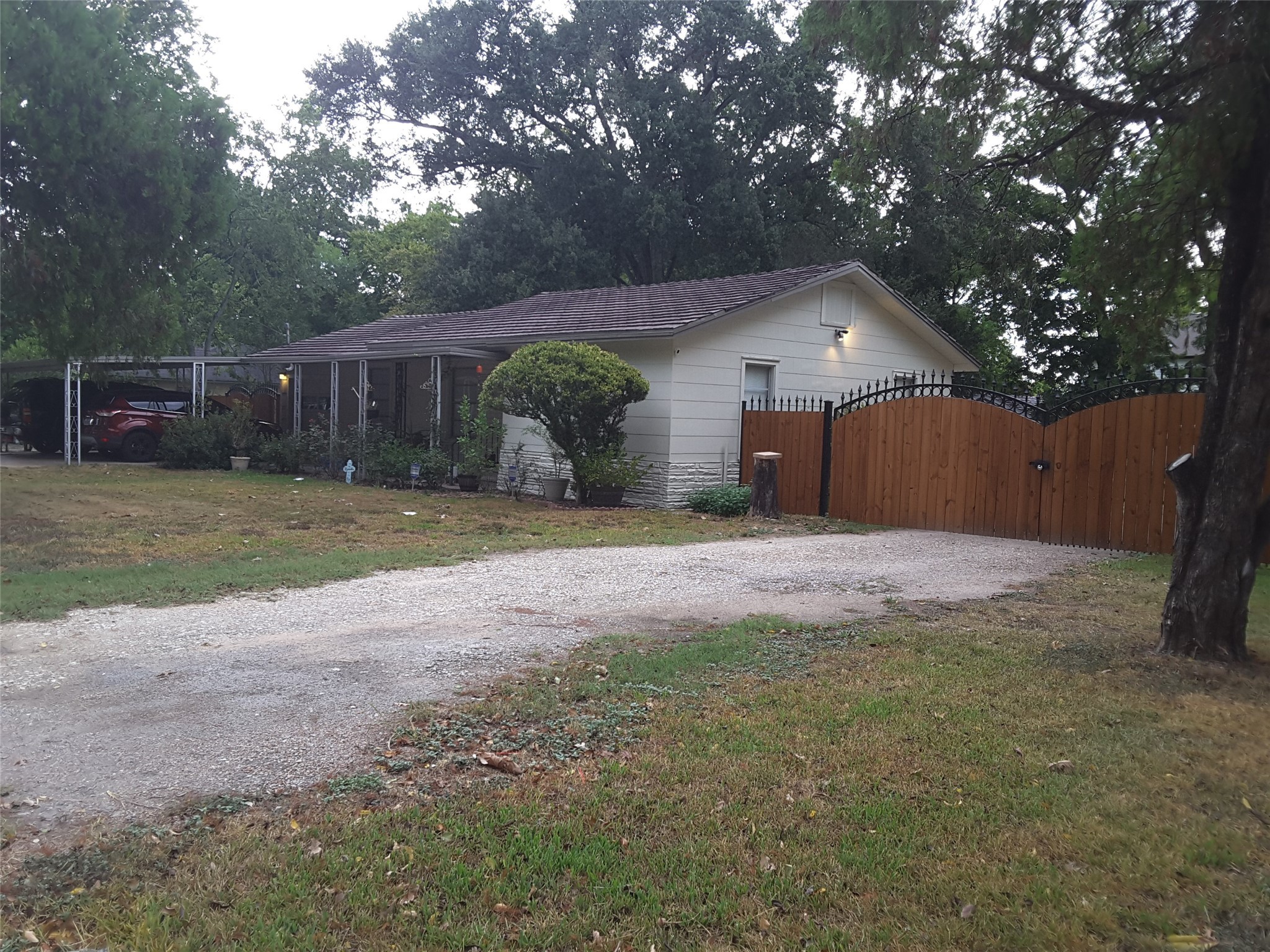 2126 Blalock Road Houston, TX 77080 - Photo 7 of 8 a front view of house with yard and trees