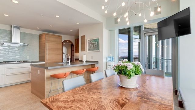 a lobby with furniture and a potted plant