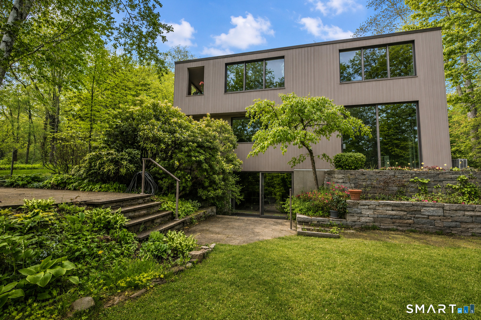 370 R Maiden Lane Durham, CT 06422 - Photo 1 of 28 Architectural design meets lush natural surroundings in this one-of-a-kind retreat with walls of glass and serene outdoor spaces