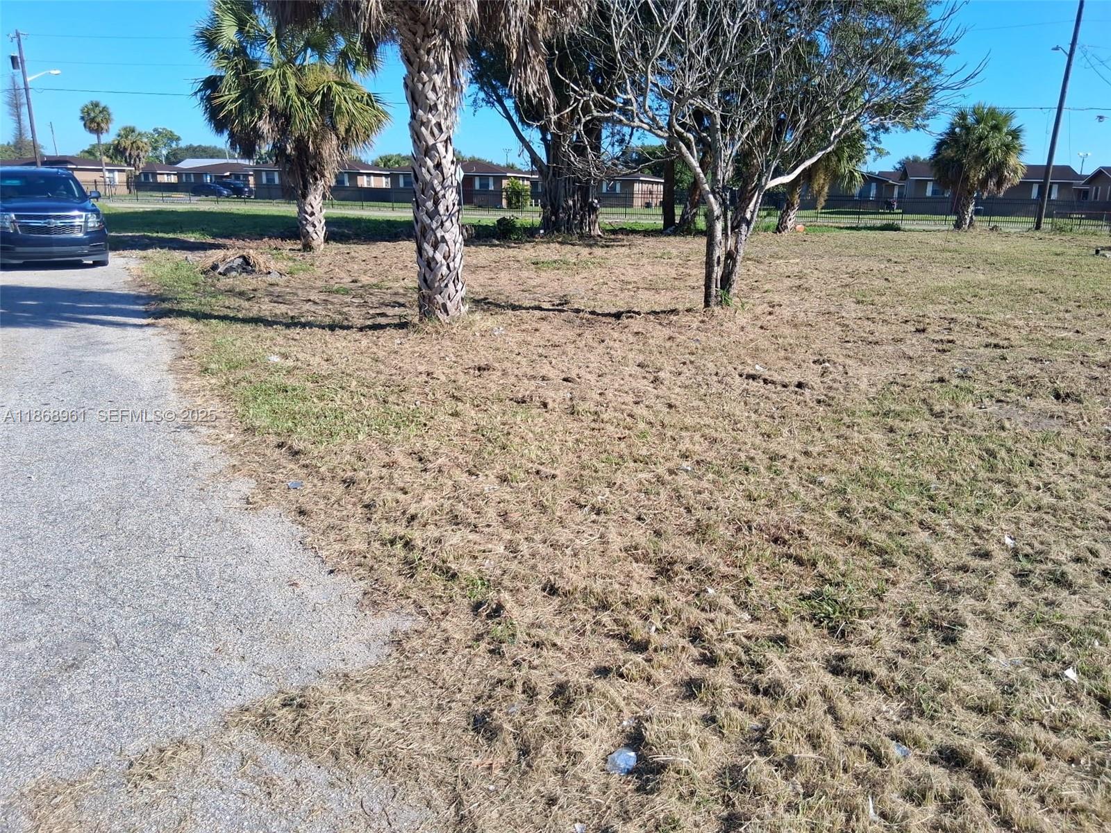 919 Virginia Avenue Clewiston, FL 33440 - Photo 2 of 11 a view of backyard with green space