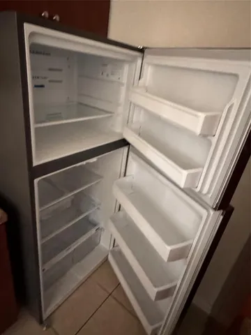 a view of hallway with seating area