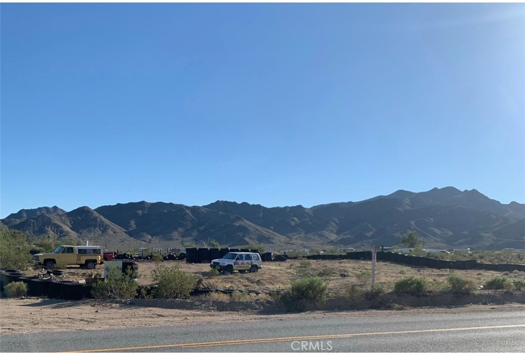 10163 Nipton Road Nipton, CA 92364 - Photo 3 of 4 a view of a town with mountains in the background